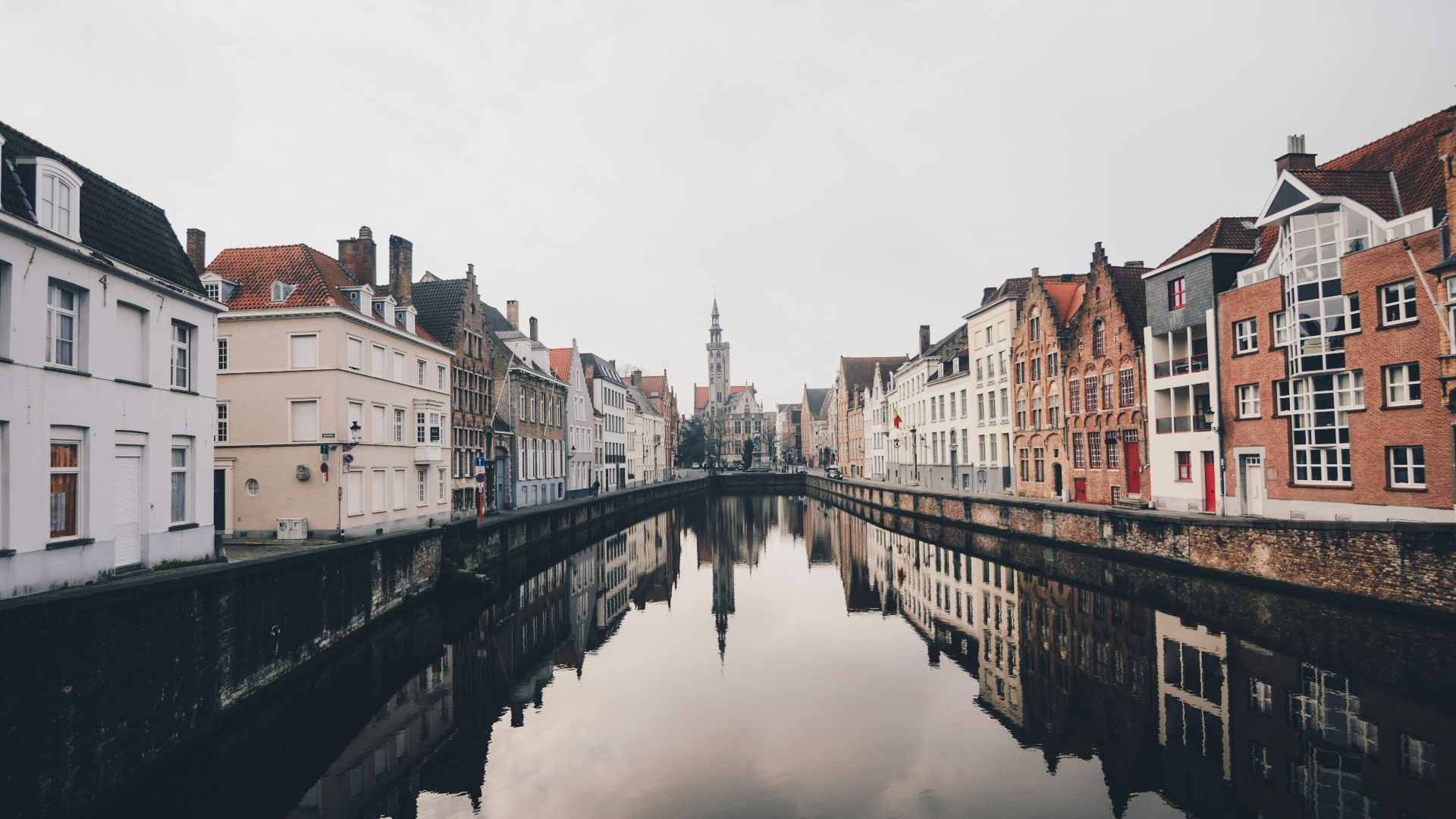 river in between houses during daytime
