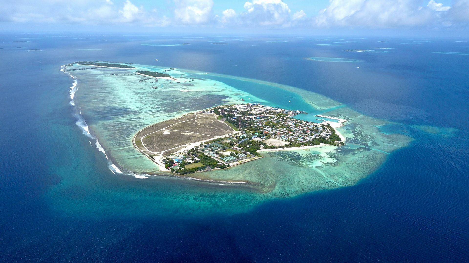 an island in the ocean with Lady Elliot Island in the background