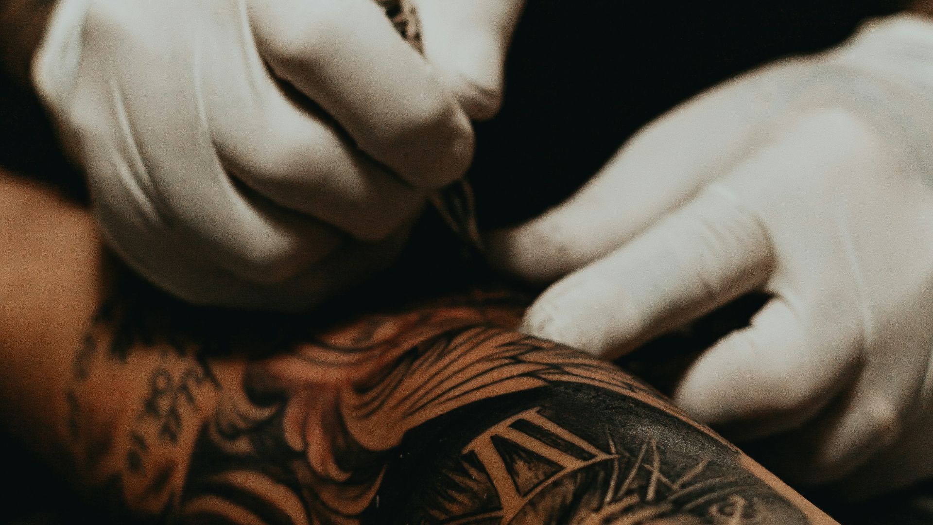 person doing tattoo