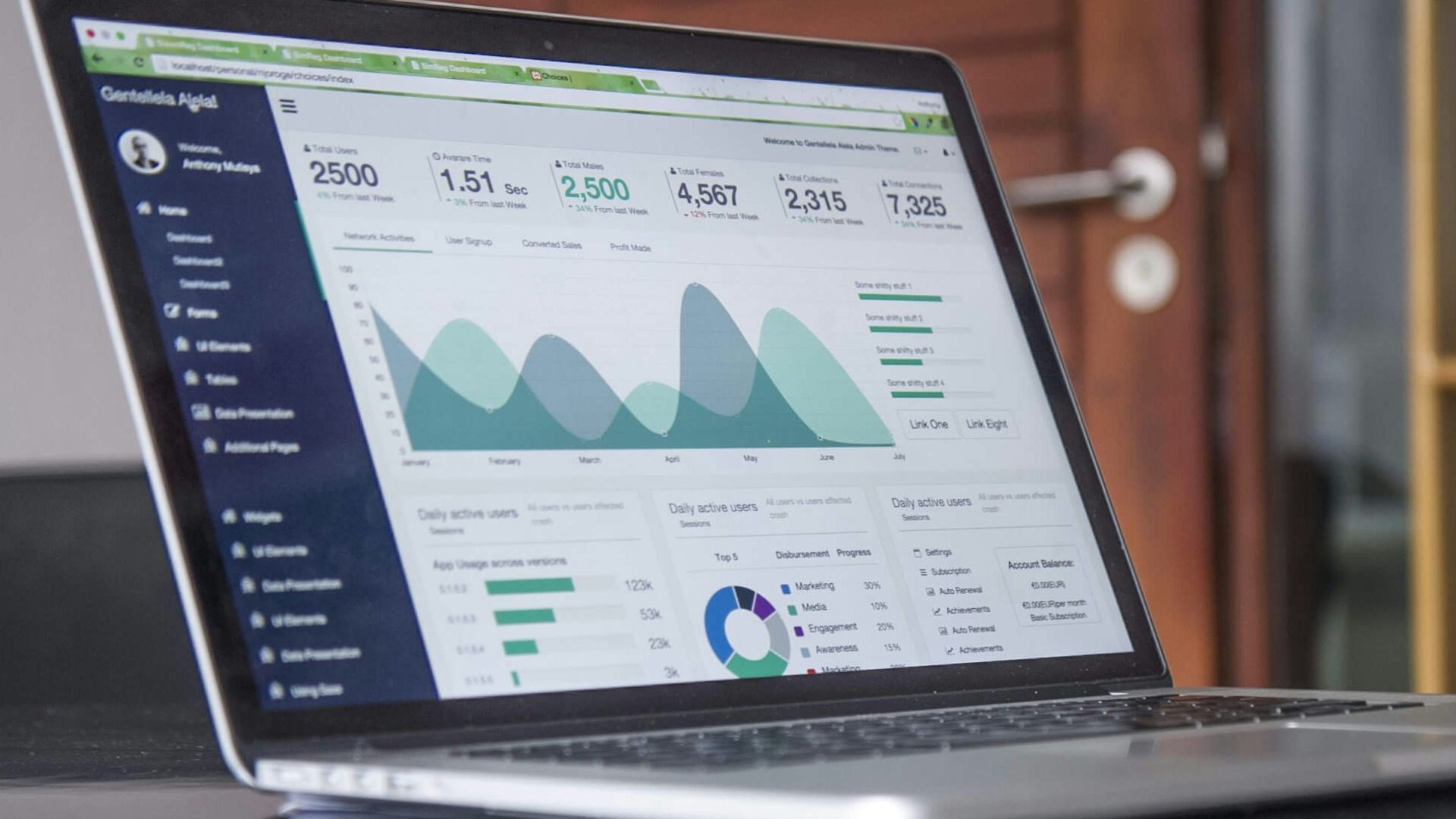 laptop computer on glass-top table