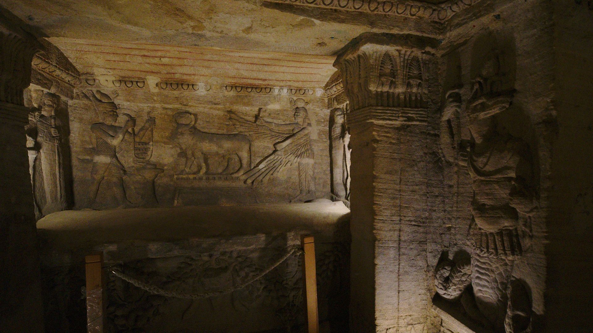 A room with a bed and a table in it