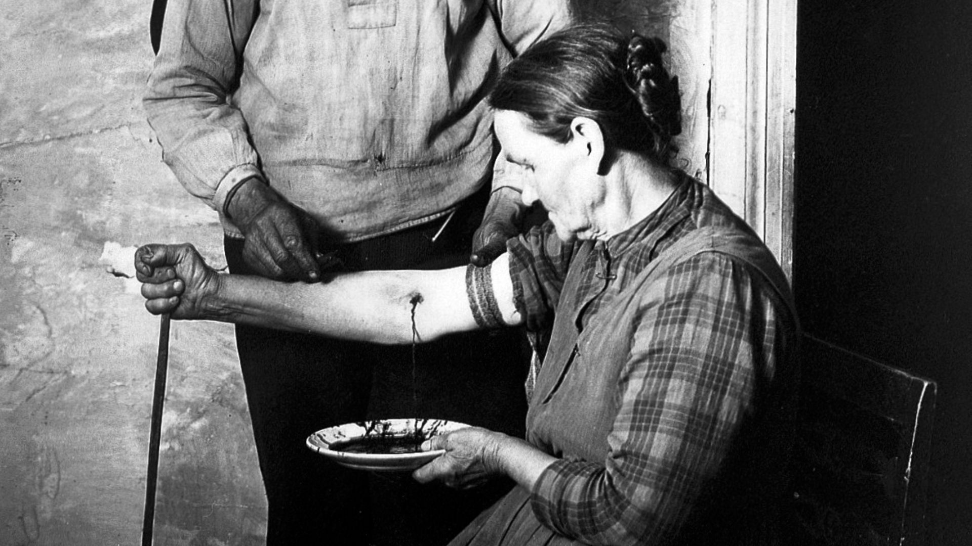 File:Bloodletting scene by N. Keyland, 1922 Wellcome L0016600.jpg
