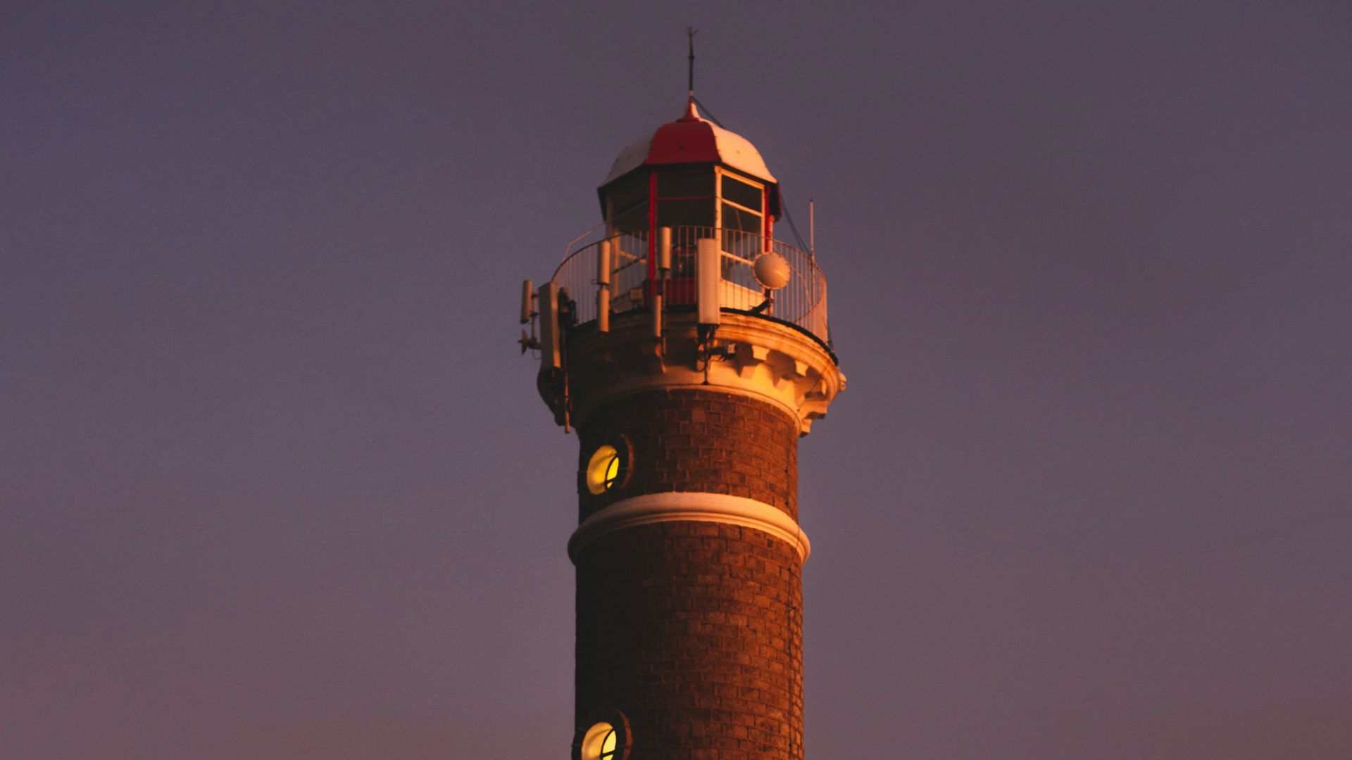 brown and black tower under gray sky