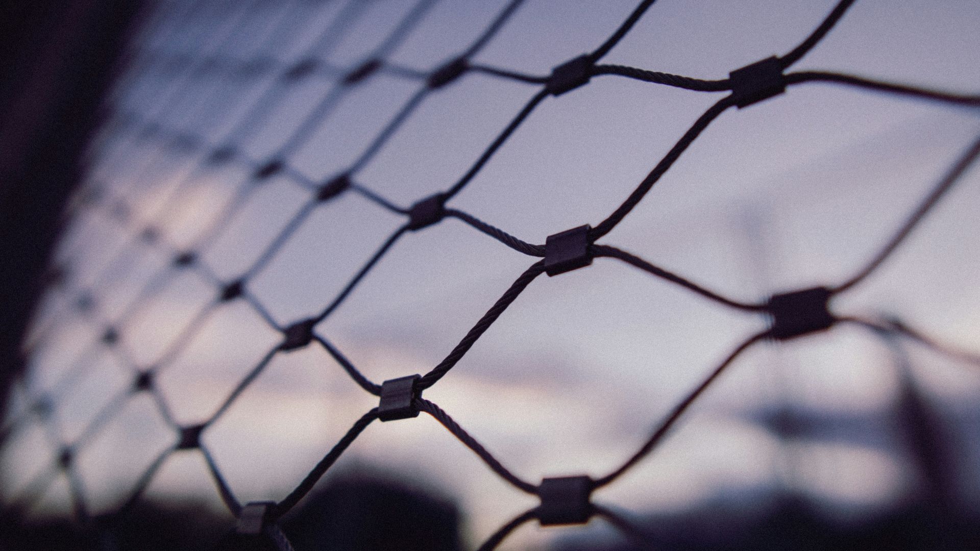 black metal fence with light