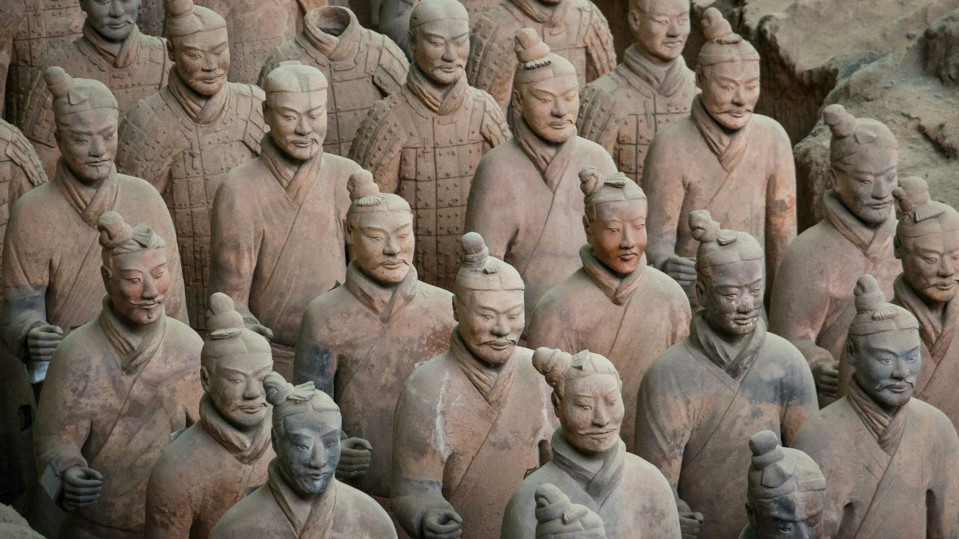 a group of men in a circle with Terracotta Army in the background