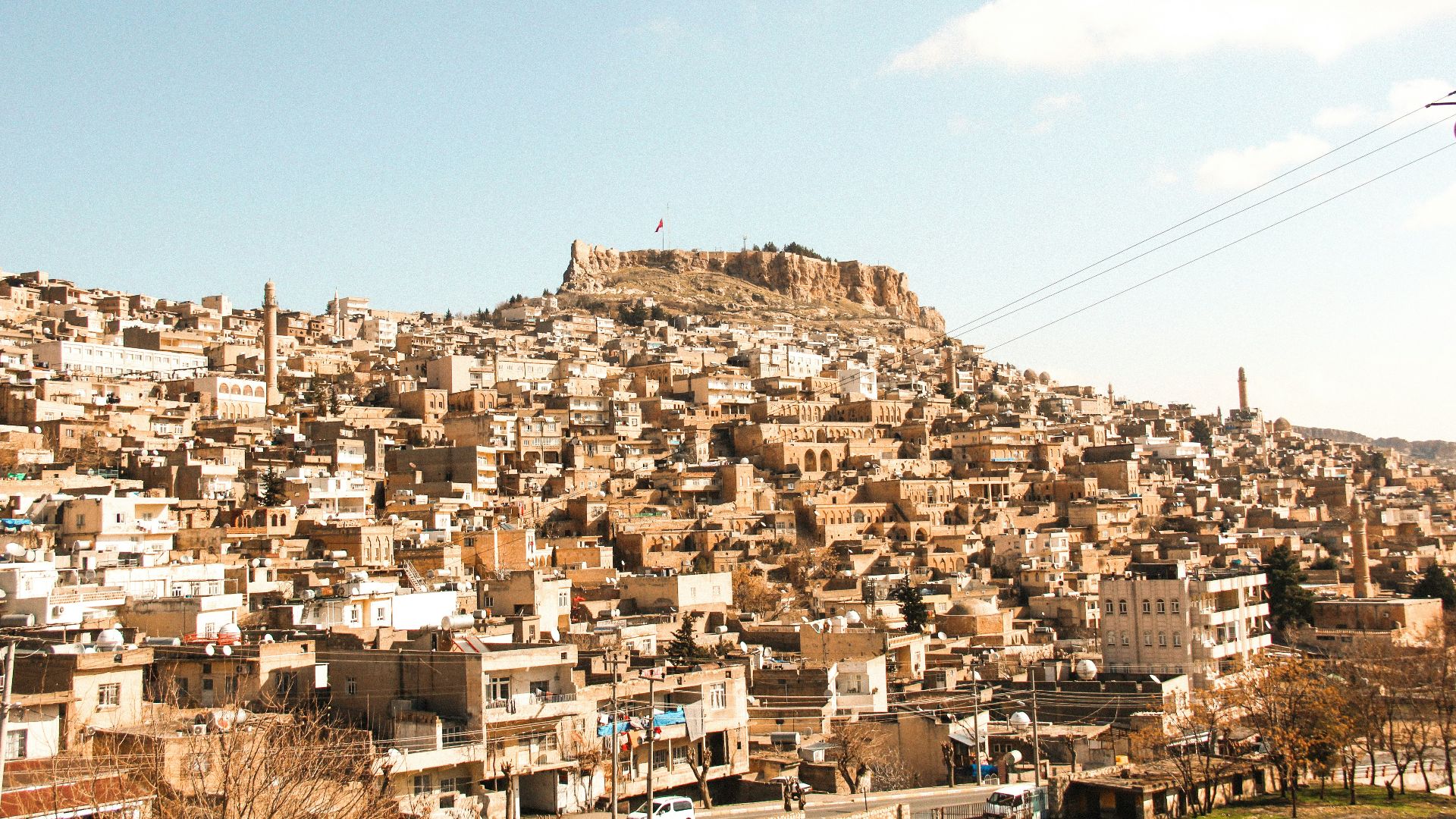 a very large city with a very tall hill in the background