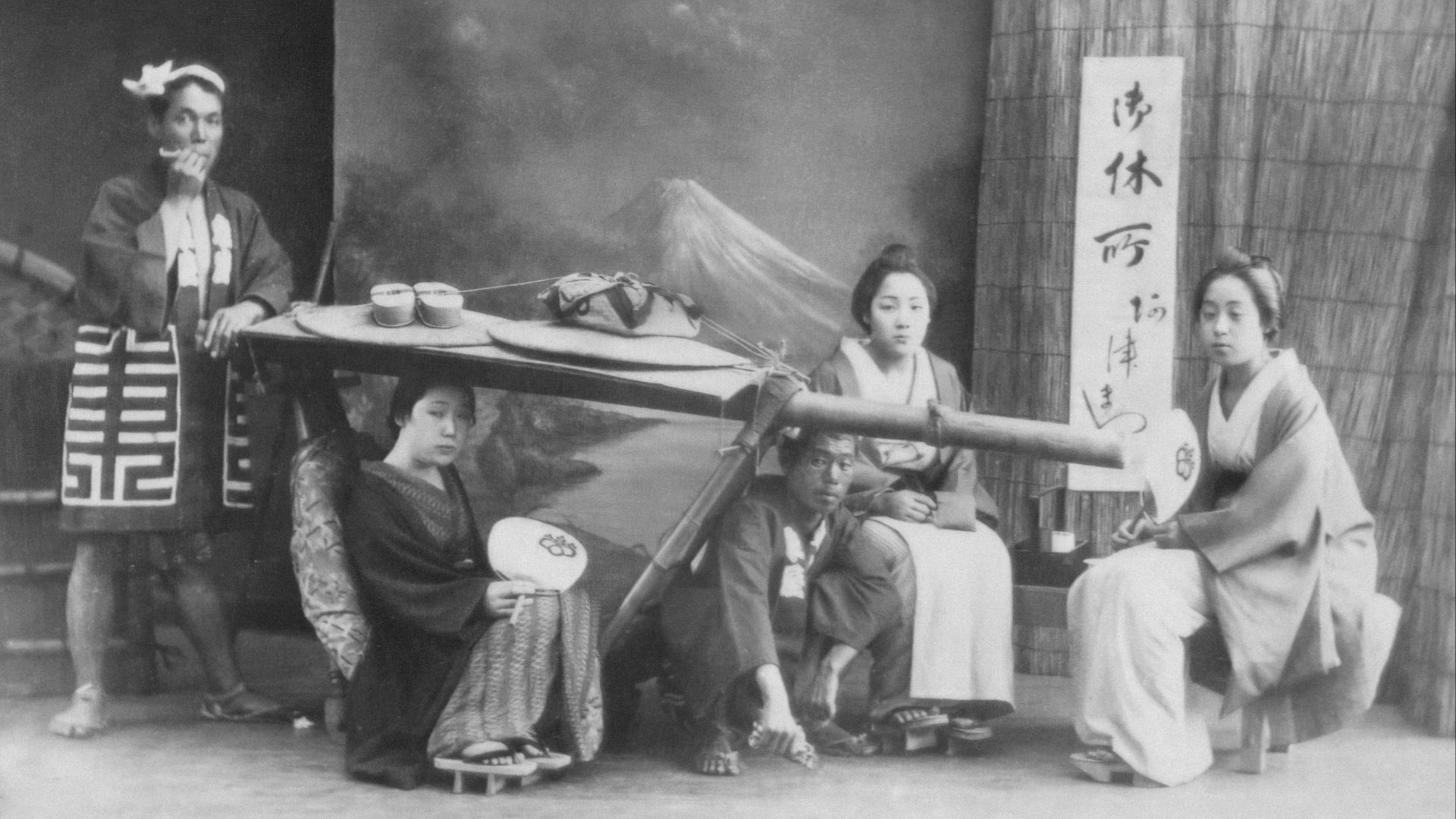 a group of asian women sitting around a table