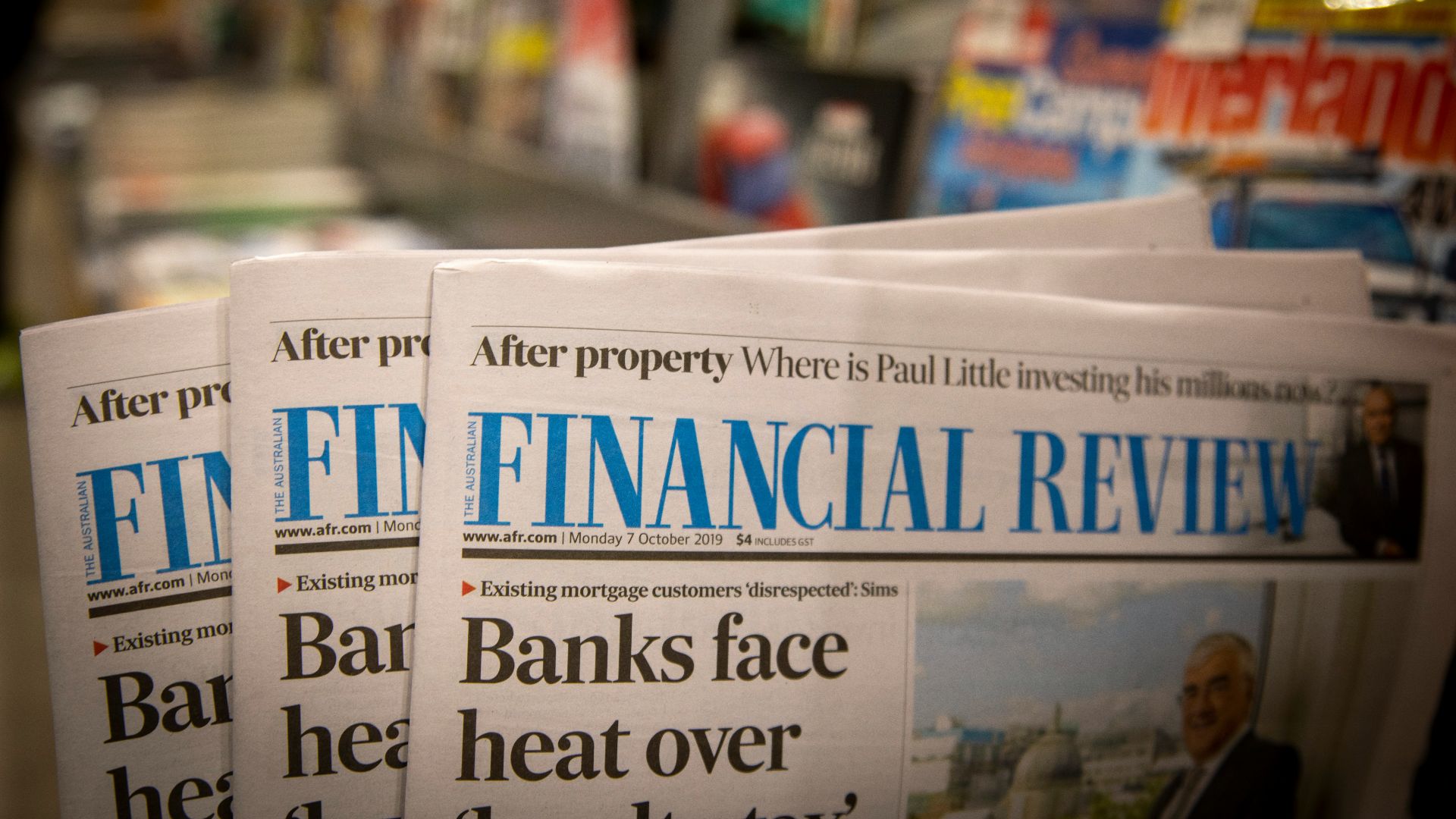 newspapers are stacked on top of each other