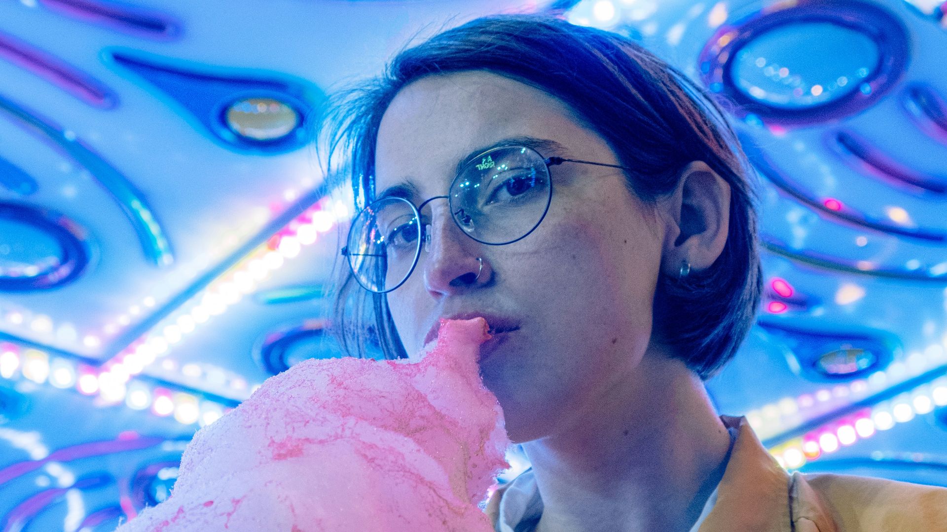 woman in brown coat wearing eyeglasses