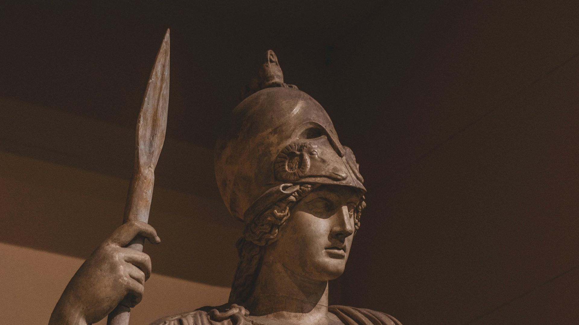 man with spear and robe statue