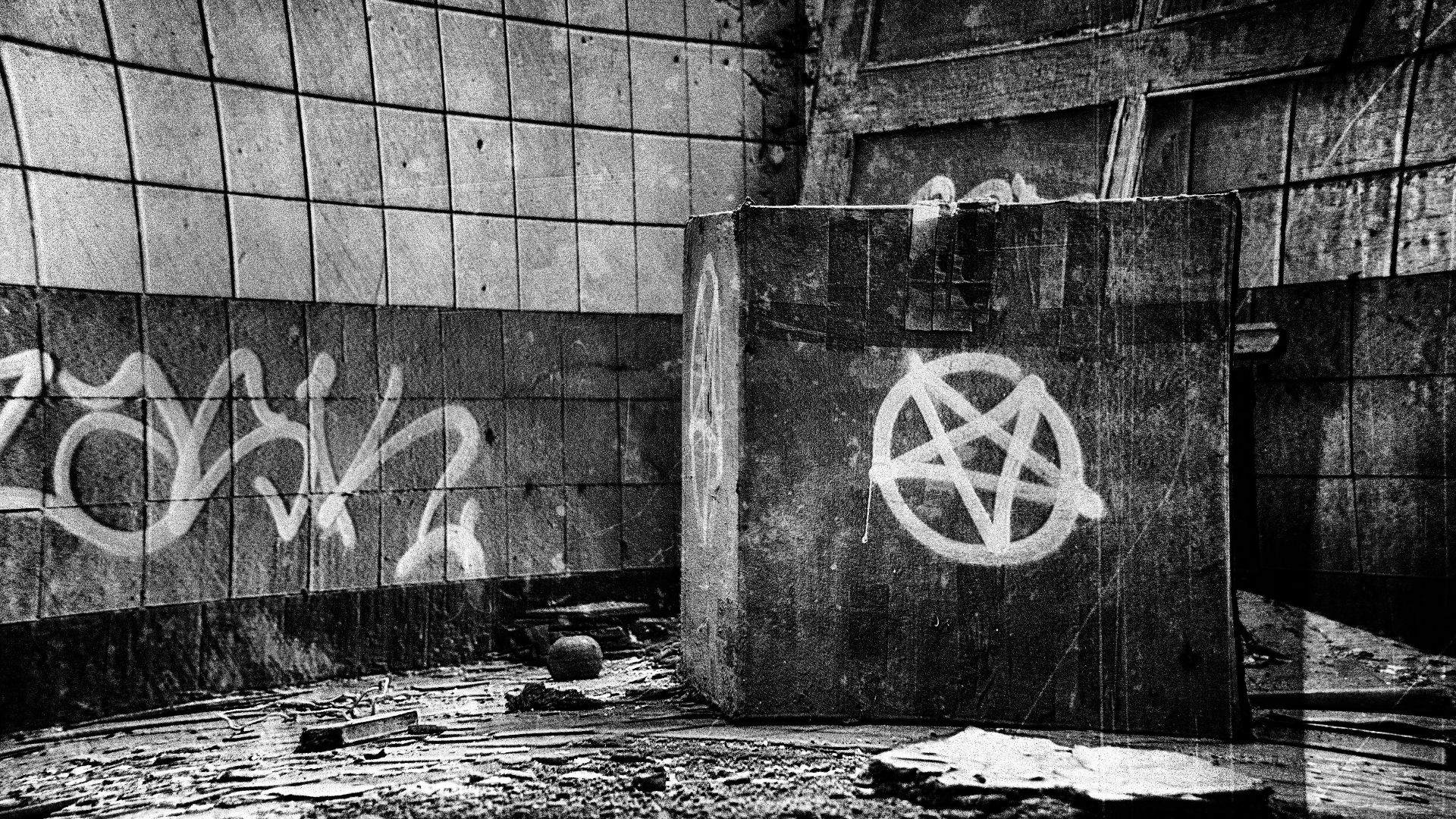 grayscale photo of concrete wall