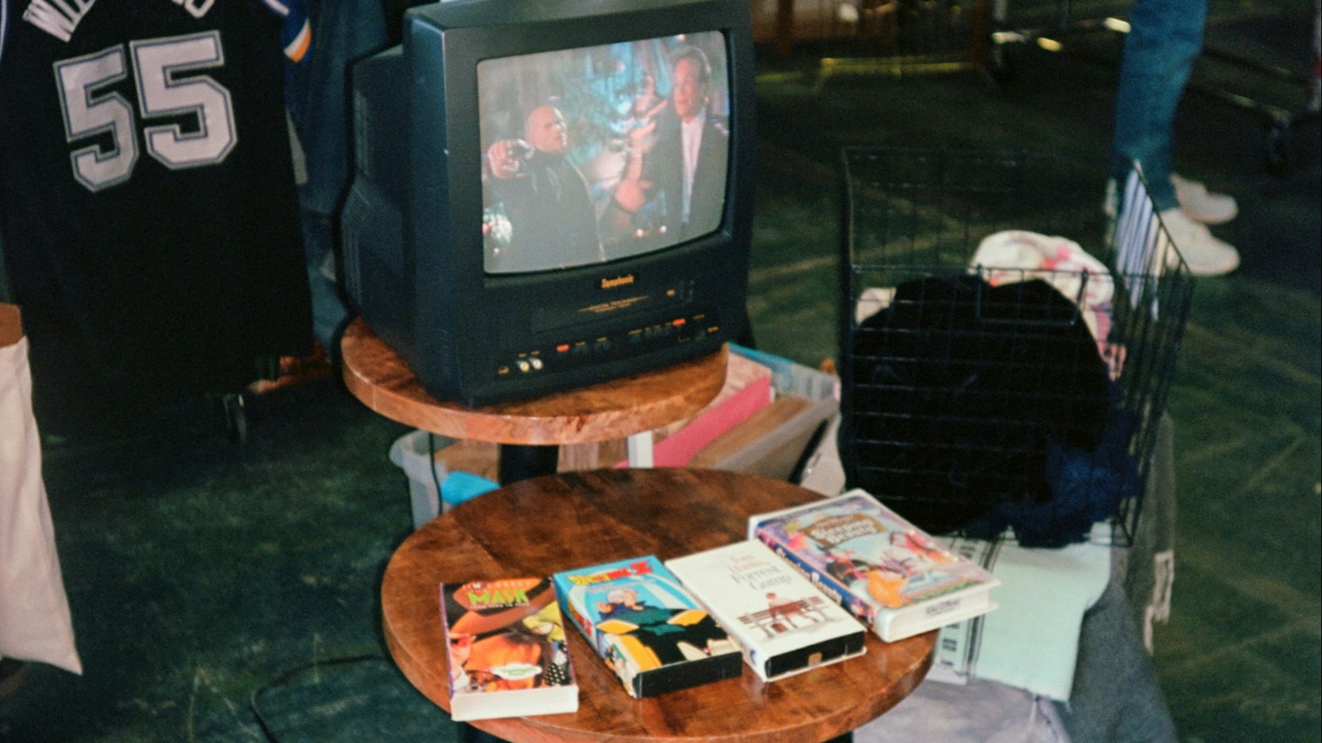 a television sitting on top of a wooden table