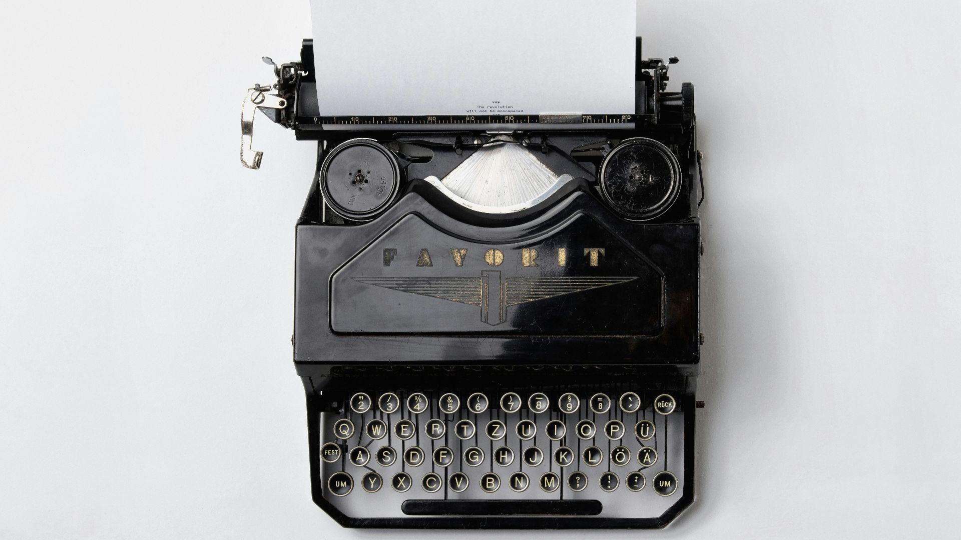 black Fayorit typewriter with printer paper