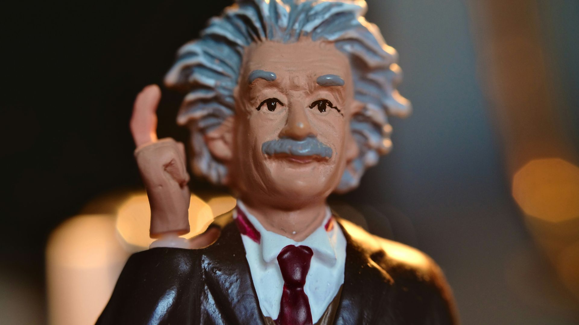 man in black suit jacket figurine