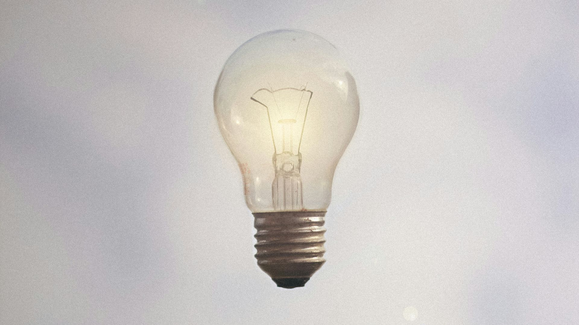 person catching light bulb