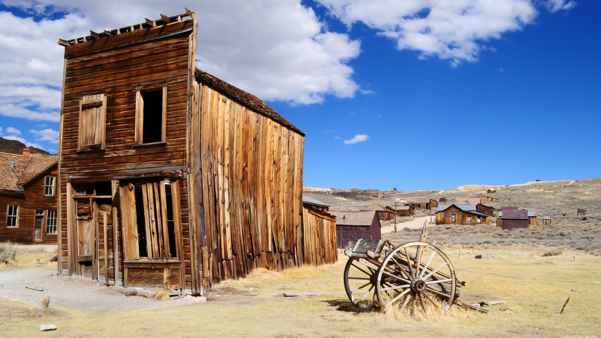 brown wooden house under white clouds