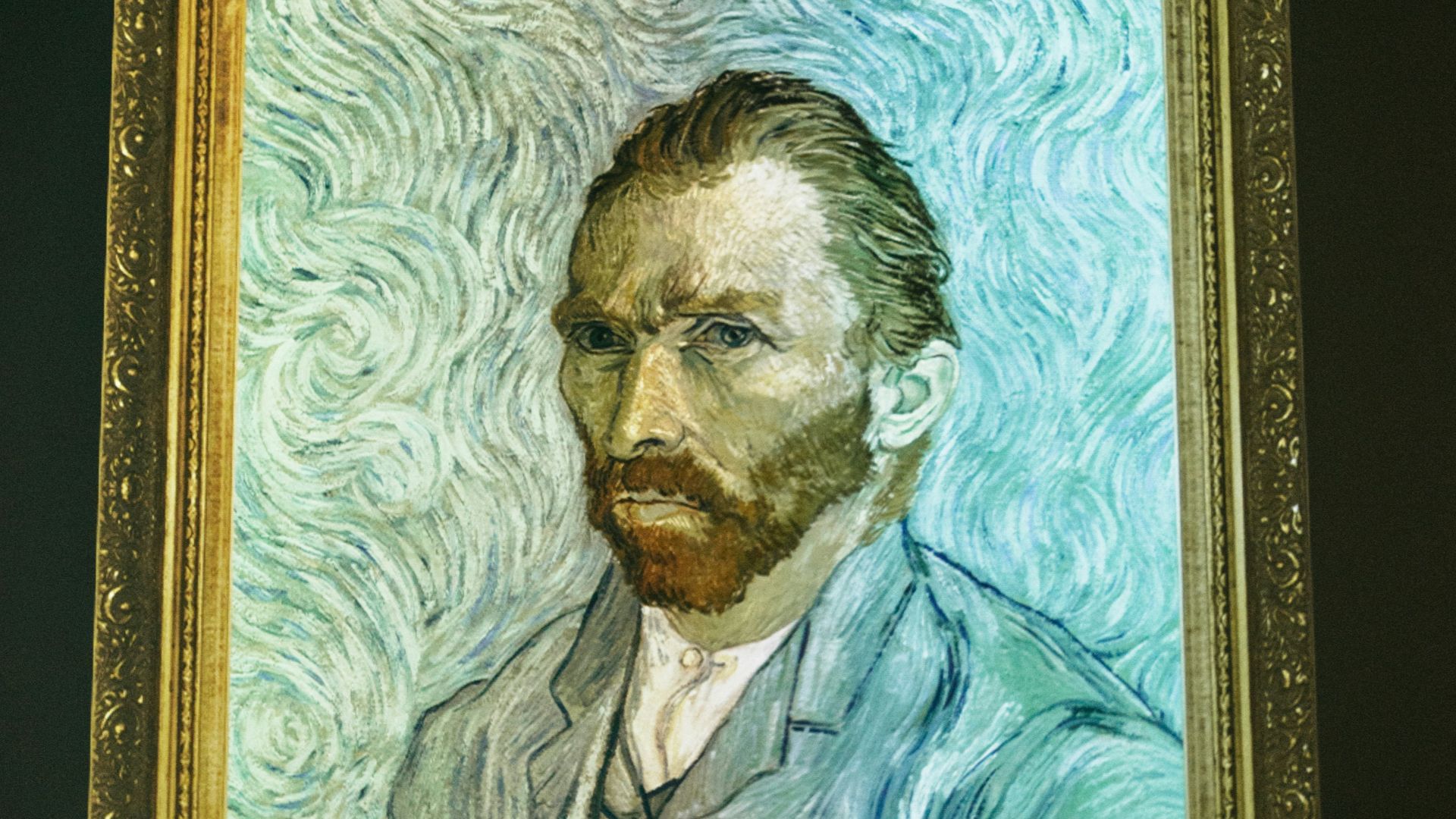 man and woman in black suit painting