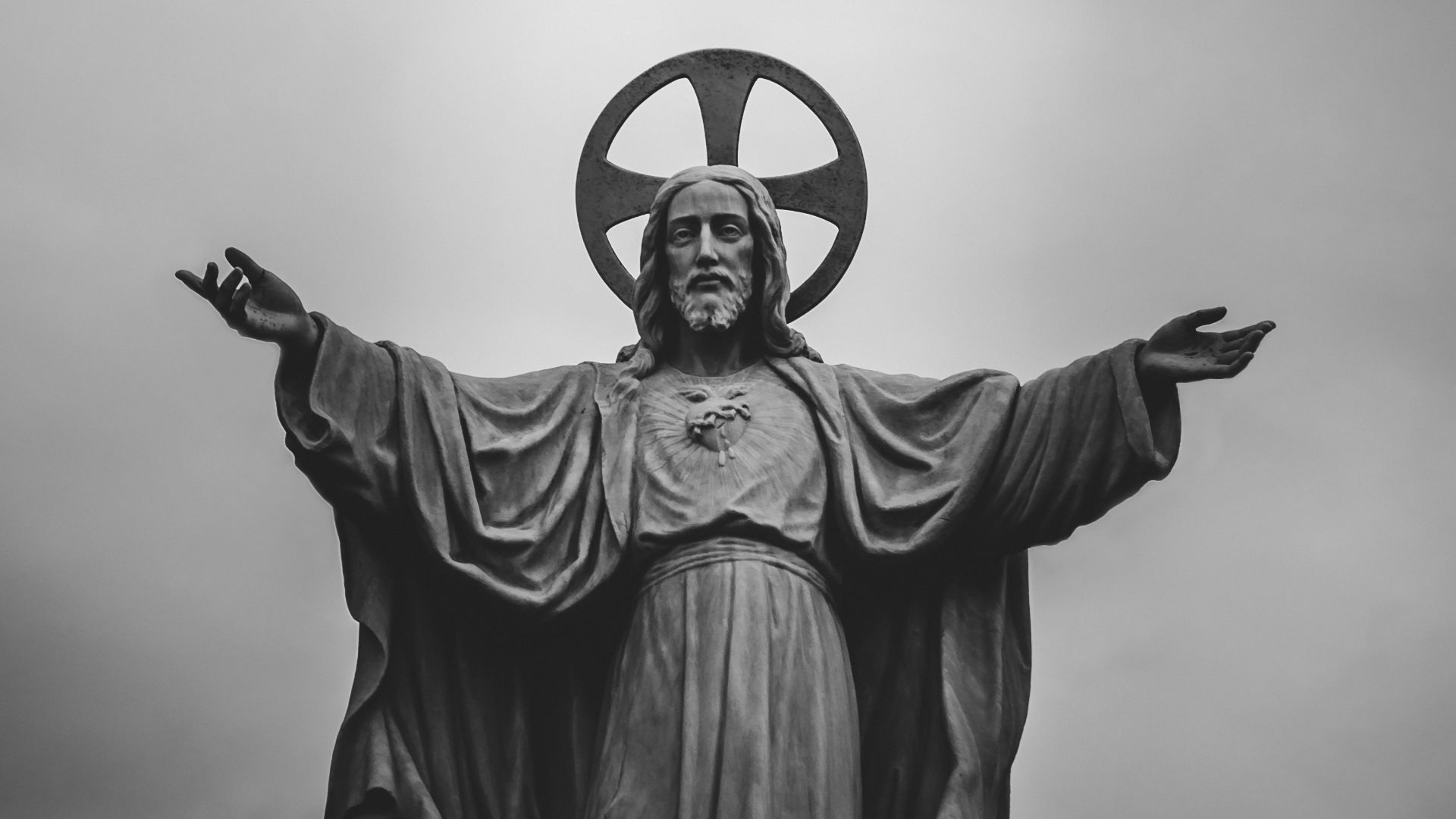 grayscale photograph of Jesus Christ statue