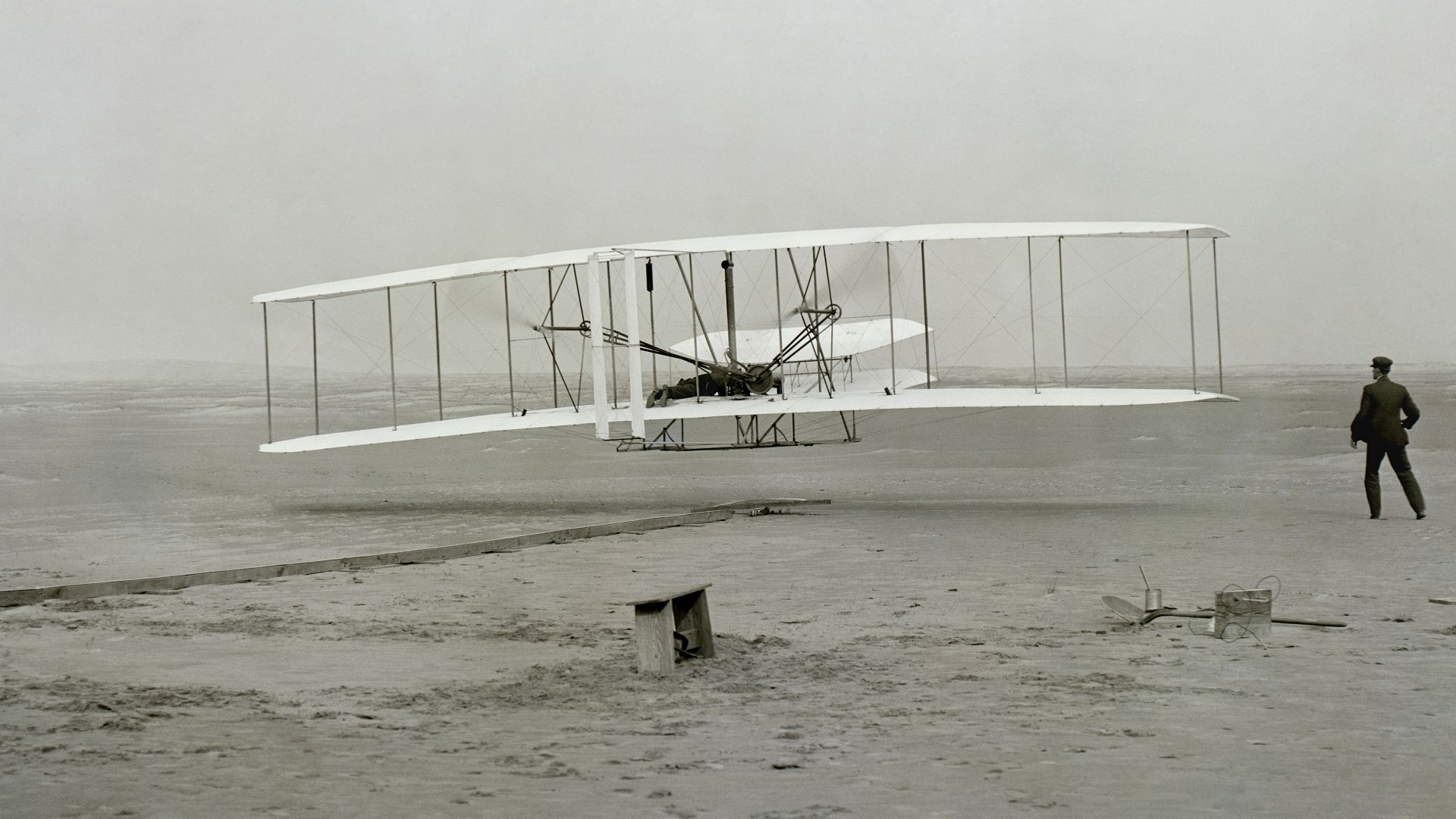 white metal fence on white sand during daytime
