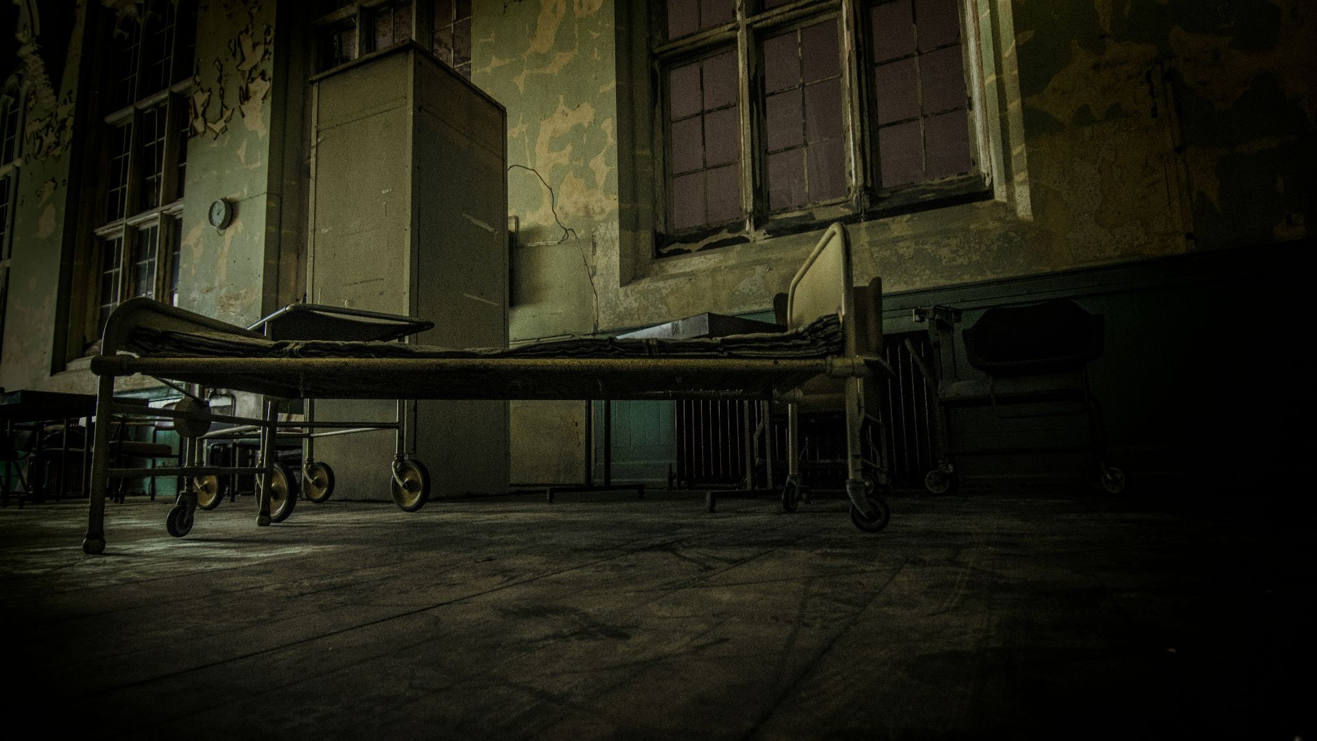 hospital bed on concrete pavement