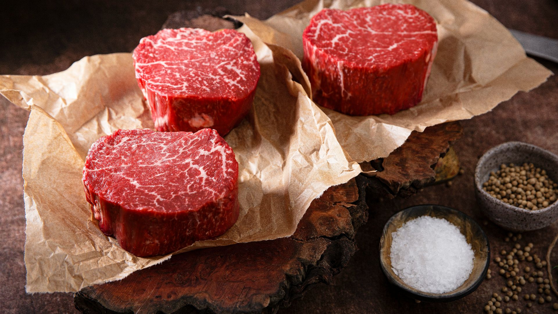 sliced meat on brown paper