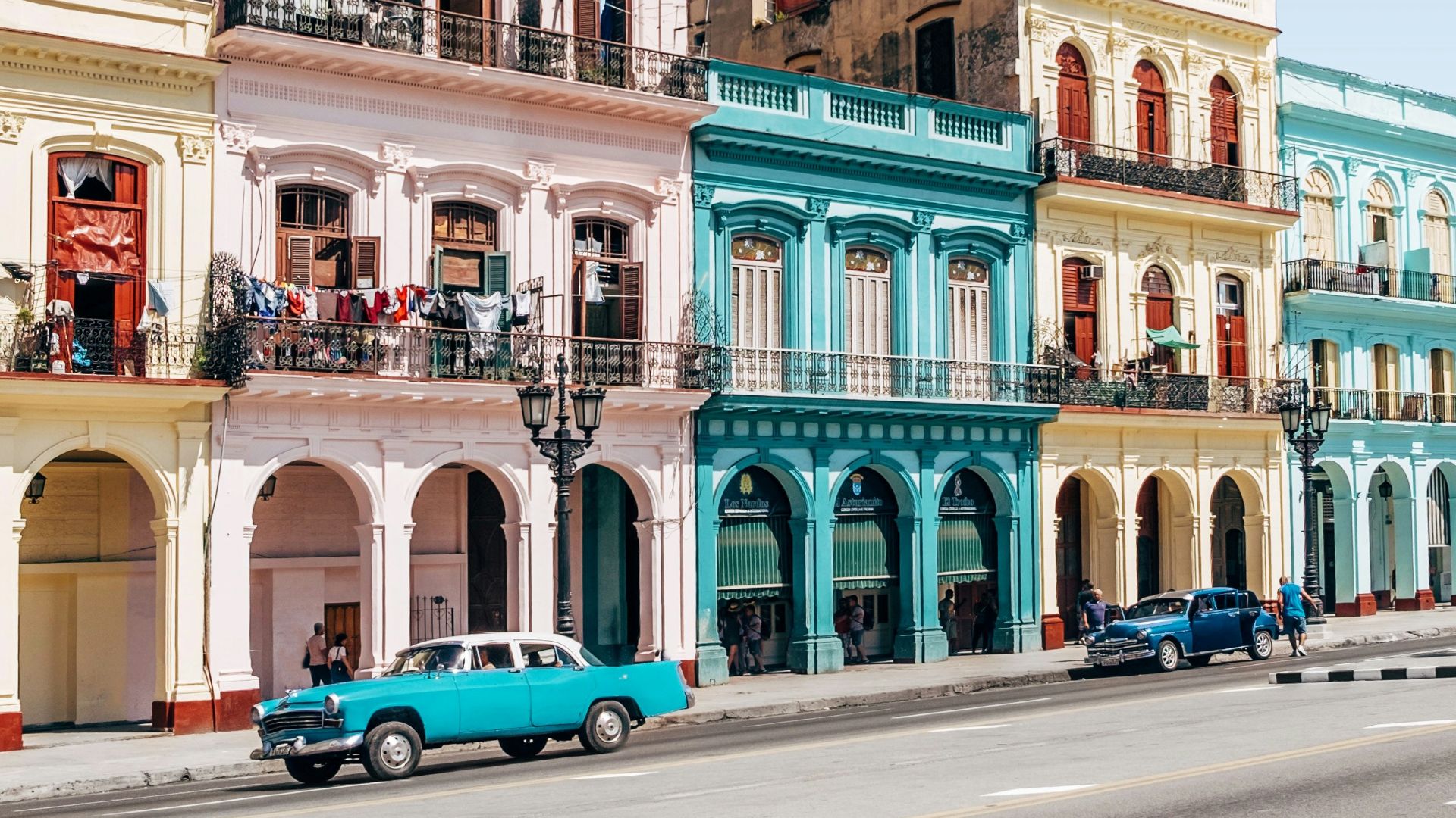 two cars parked outside building