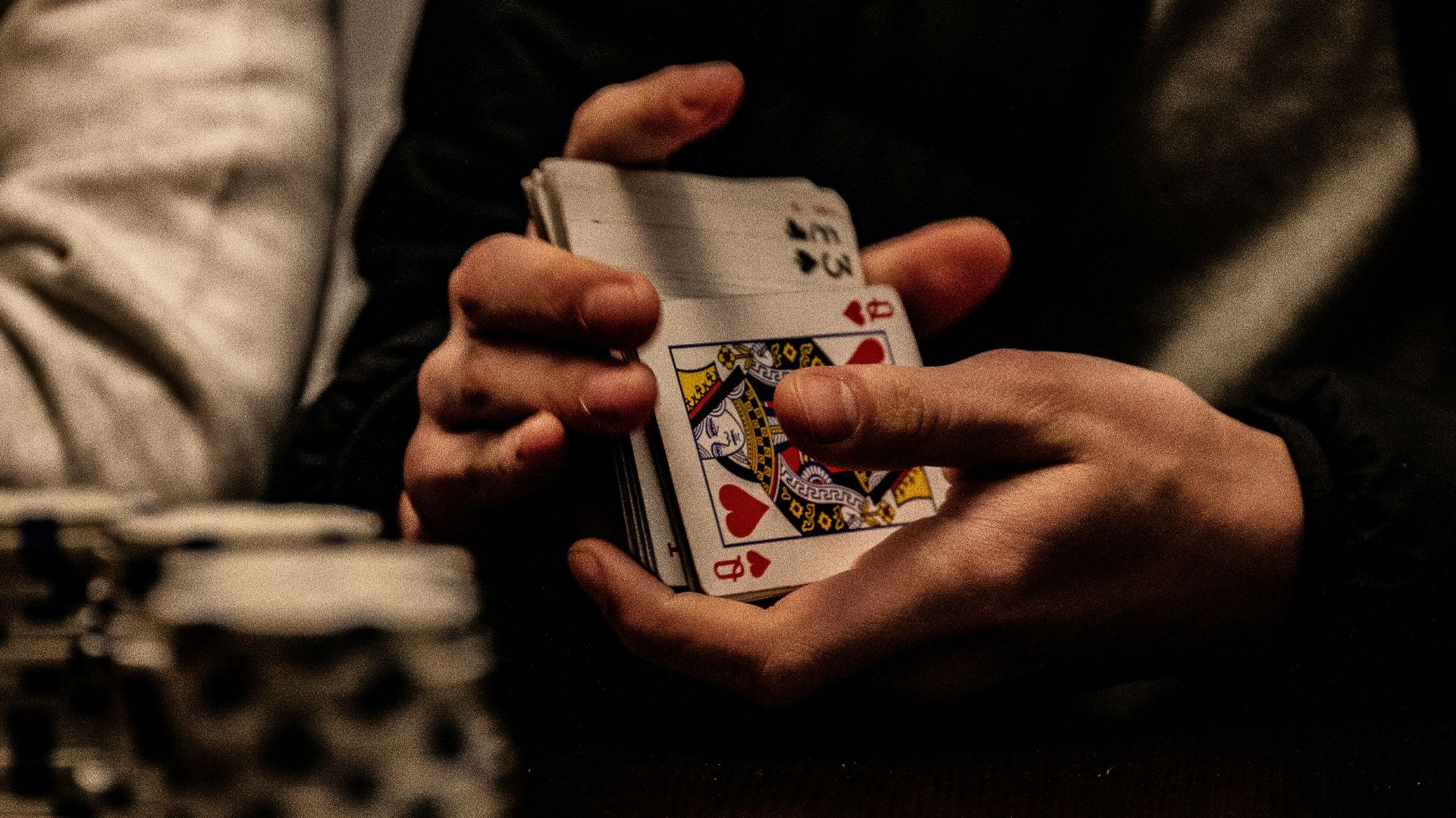 person holding king of spade playing card