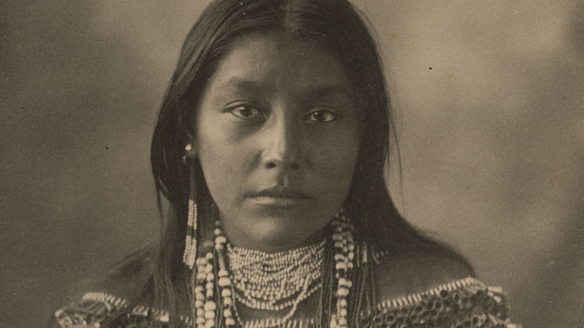 woman in black and gold dress