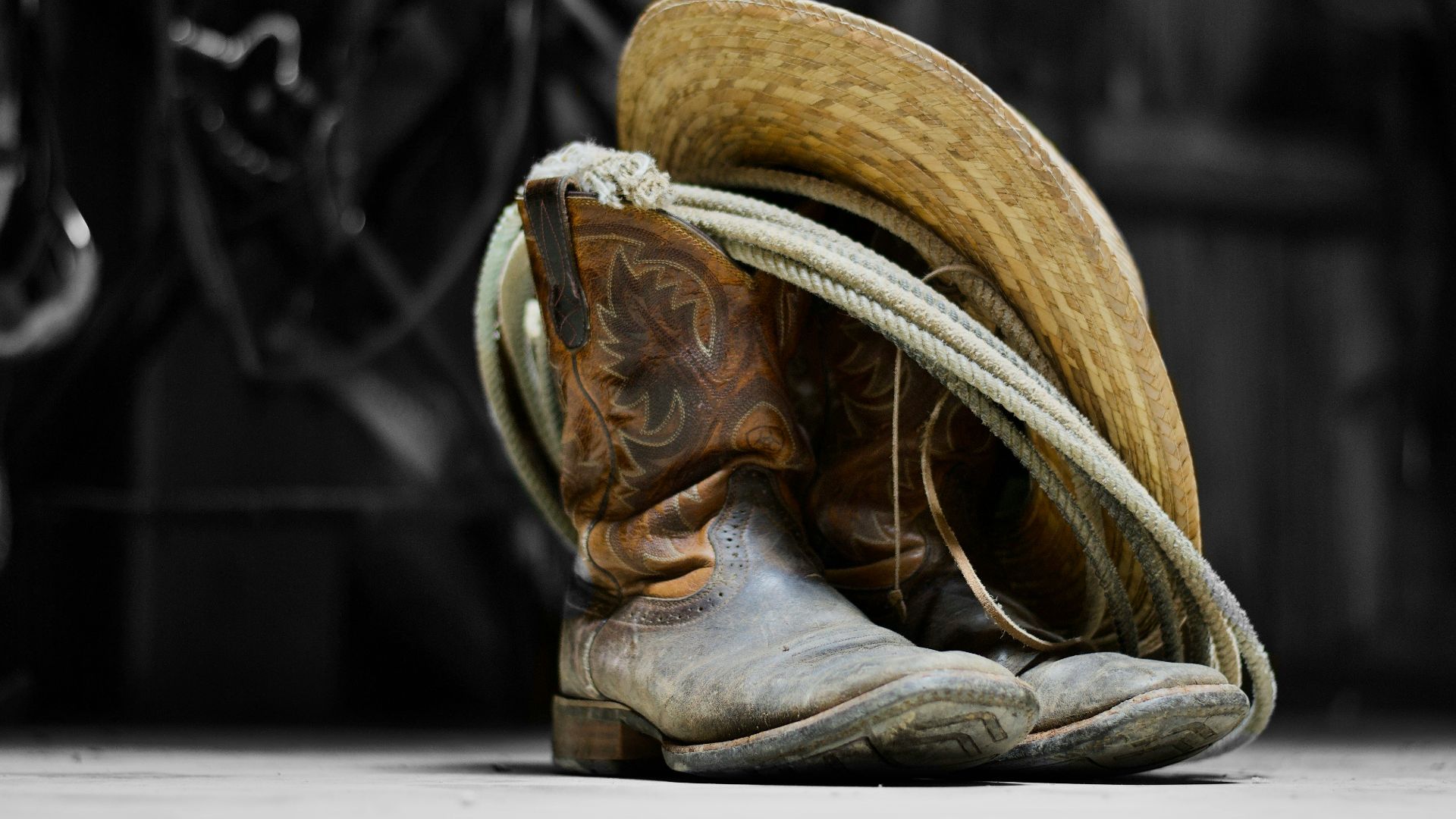 brown cowboy boots on white textile