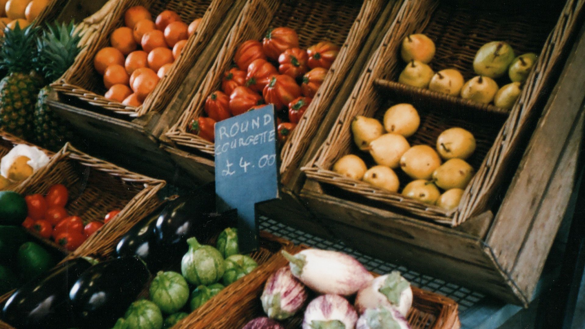 assorted fruits on brown wooden crate