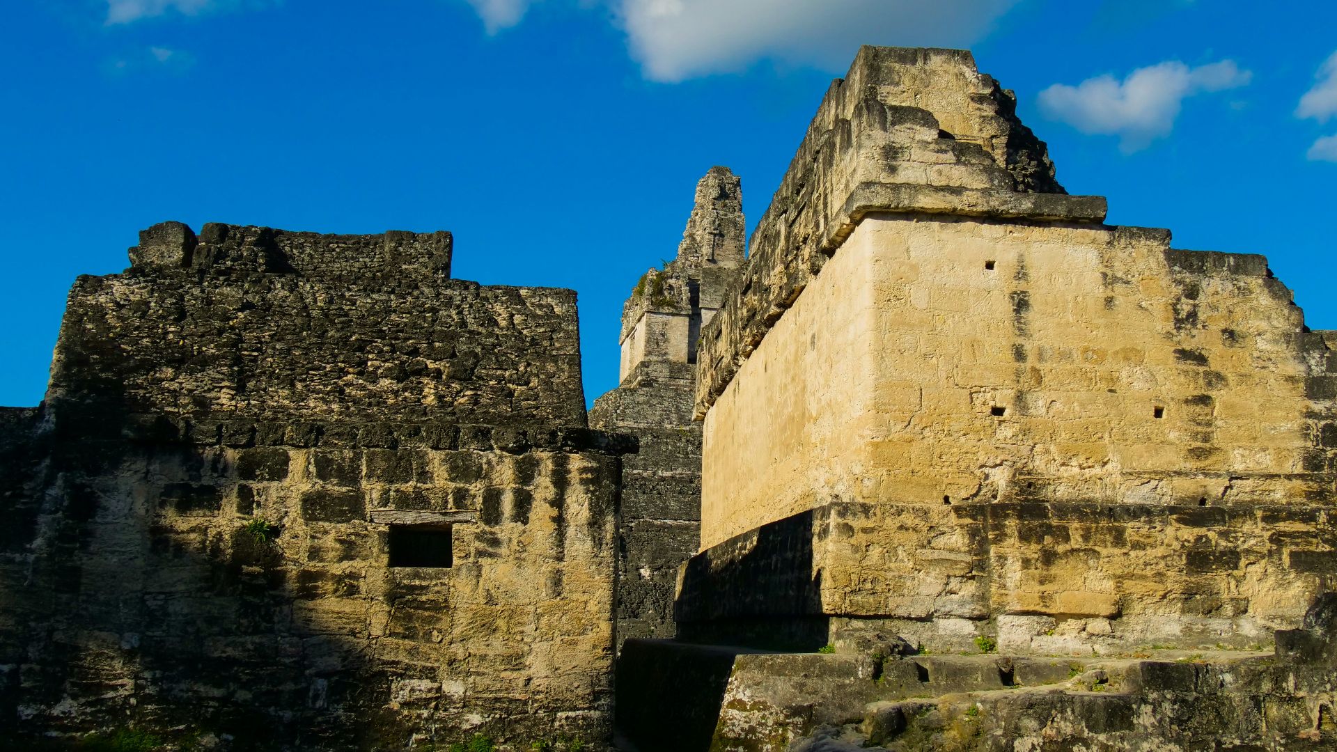 a large stone structure with a sky in the background
