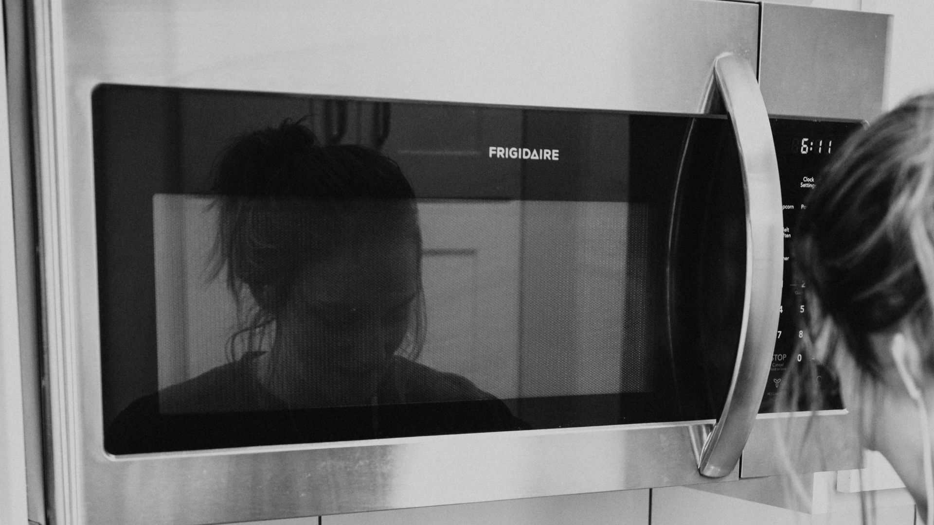 gray scale photo of microwave oven