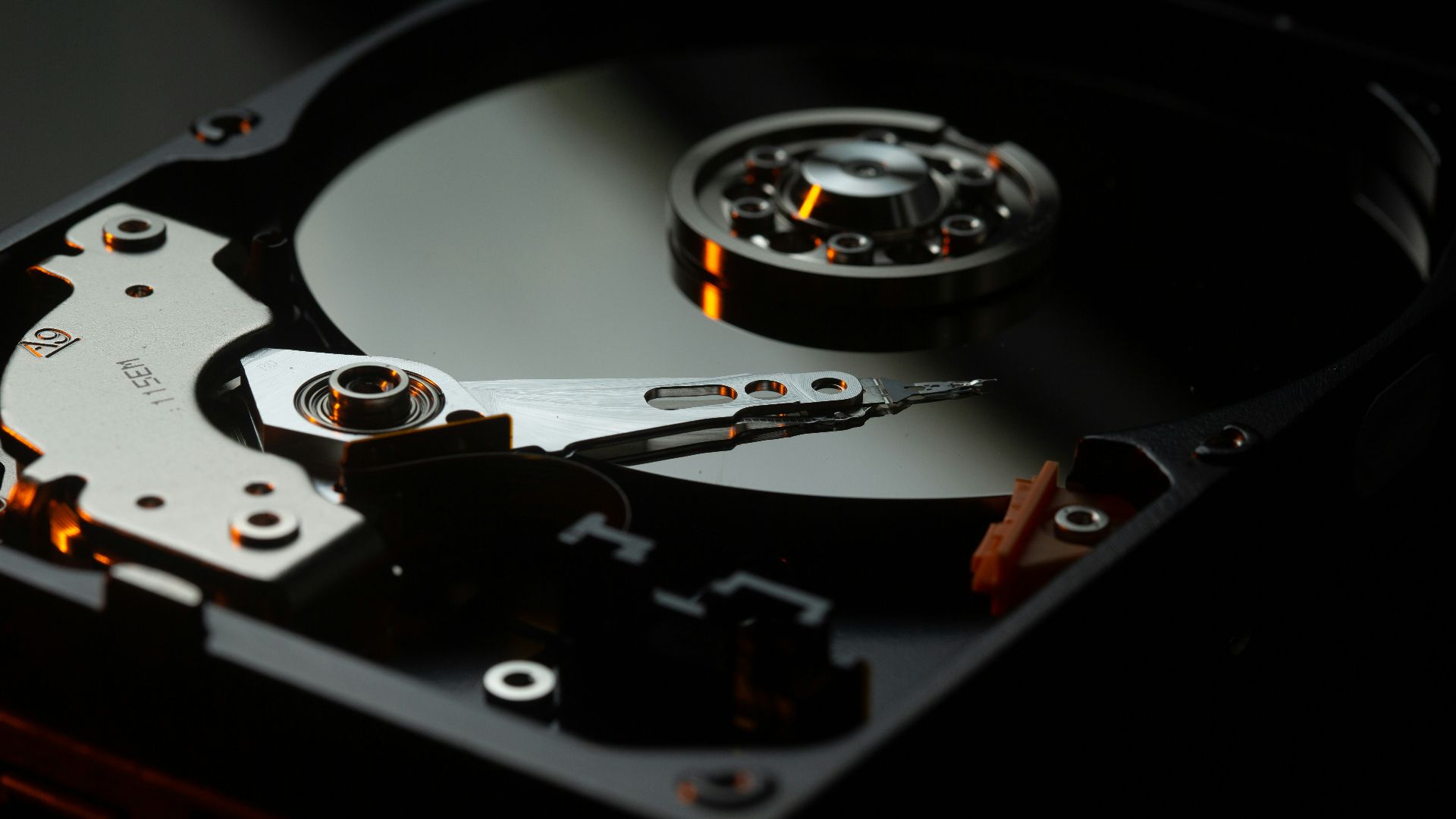 black and silver turntable on brown wooden table