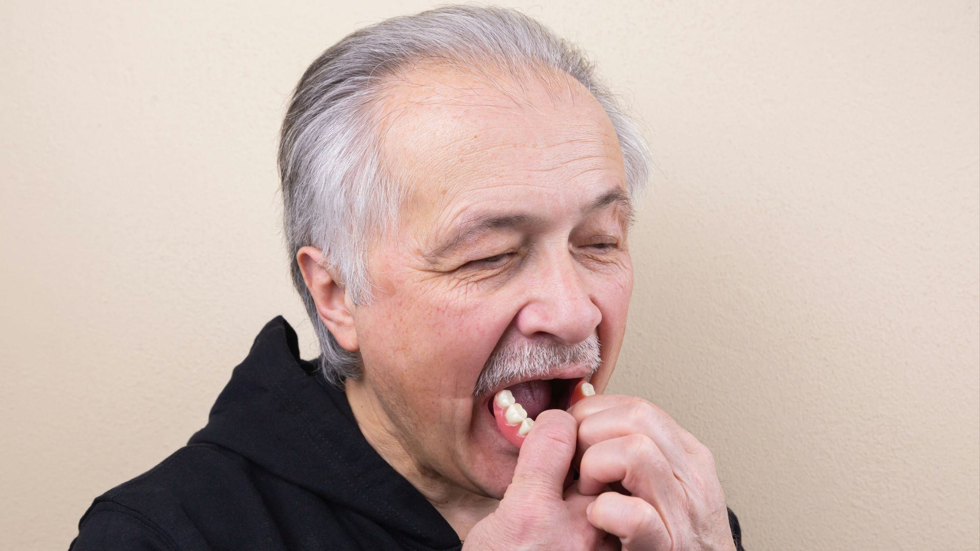 man in black hoodie smoking