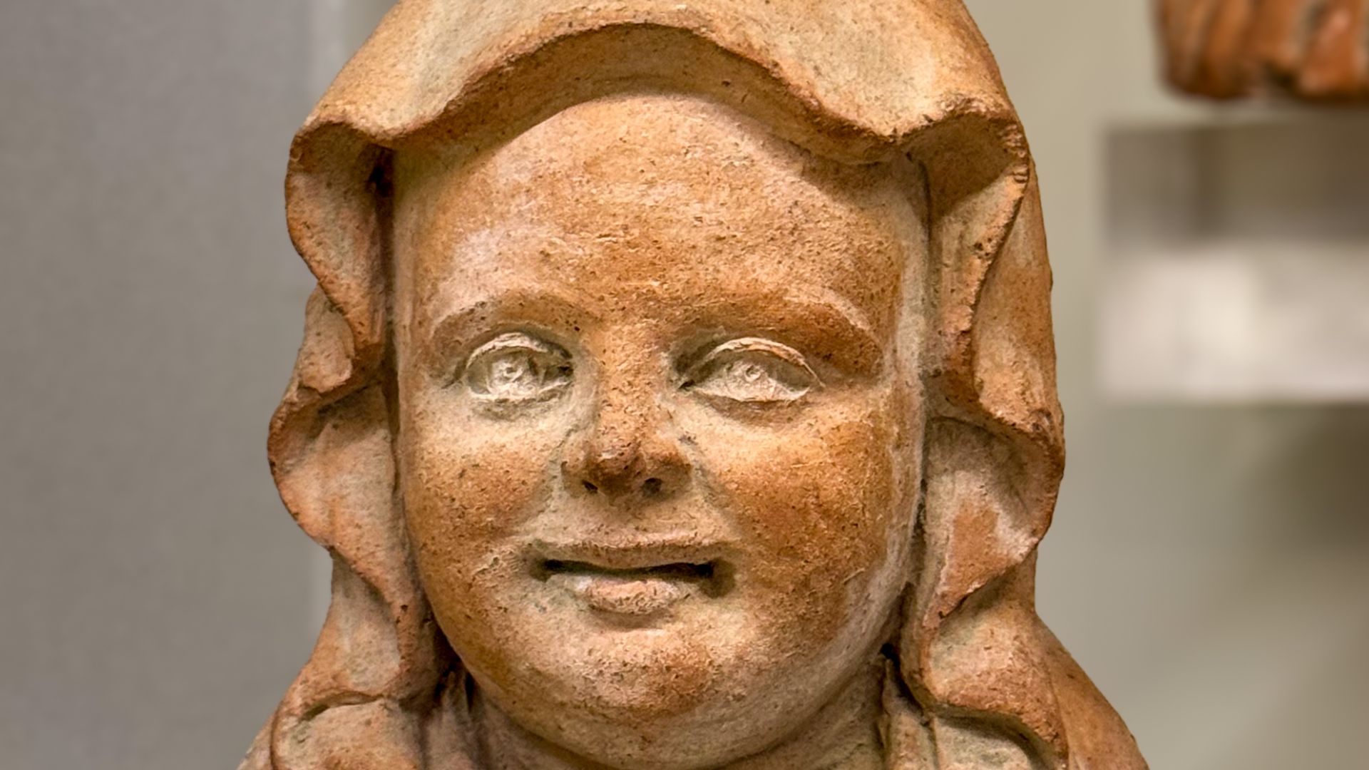 File:Etruscan terracotta head from a votive statue, depicting a swaddled newborn.jpg