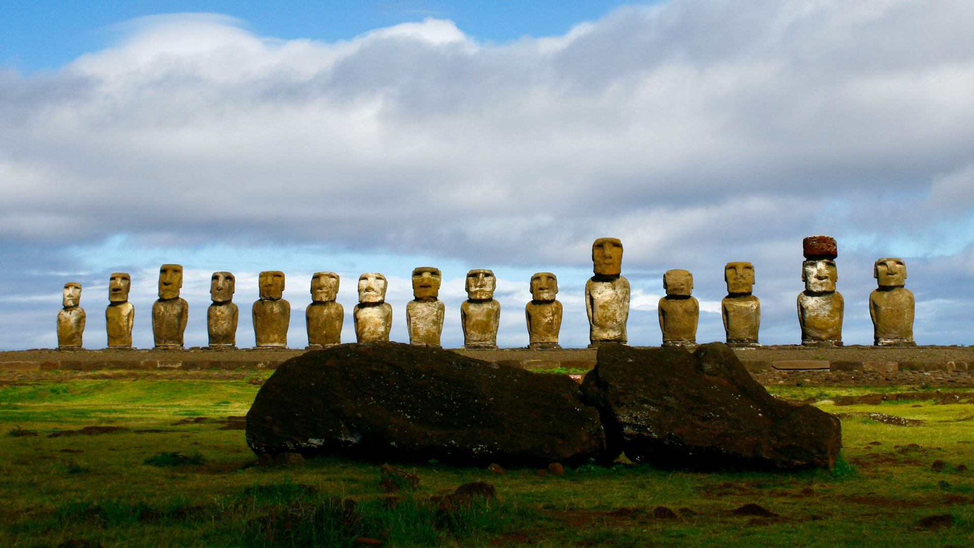 gray rock formation under white clouds and blue sky during daytime