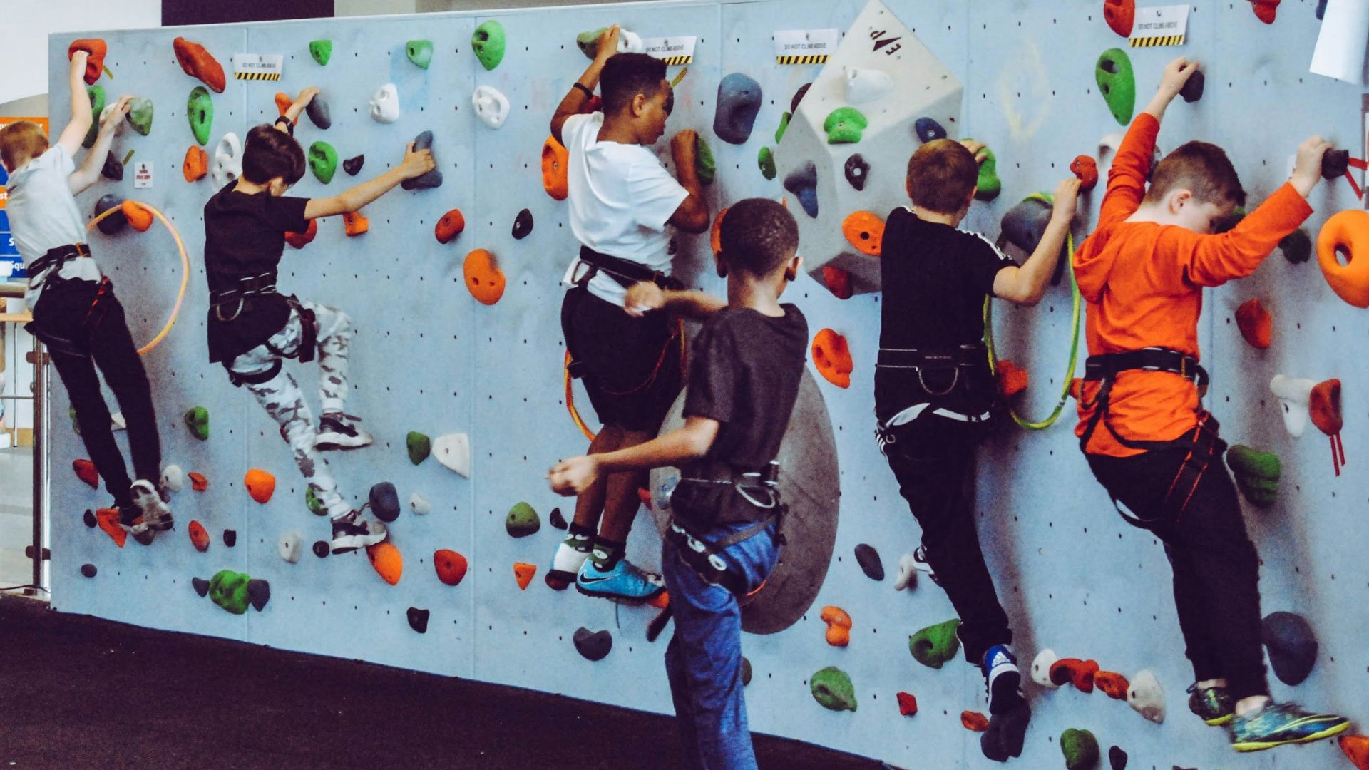 kids on test climb rock