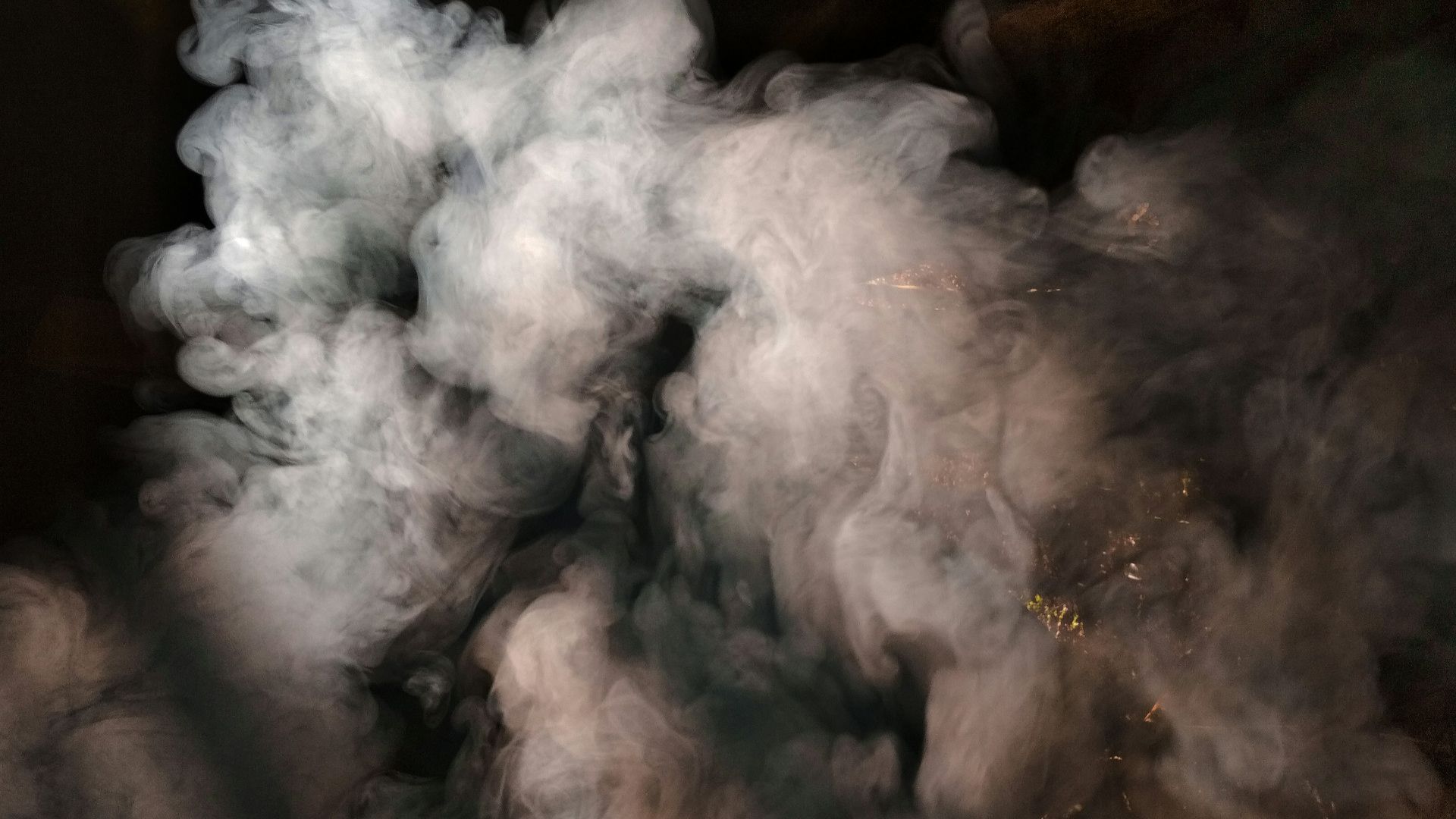 white smoke coming out from brown wood