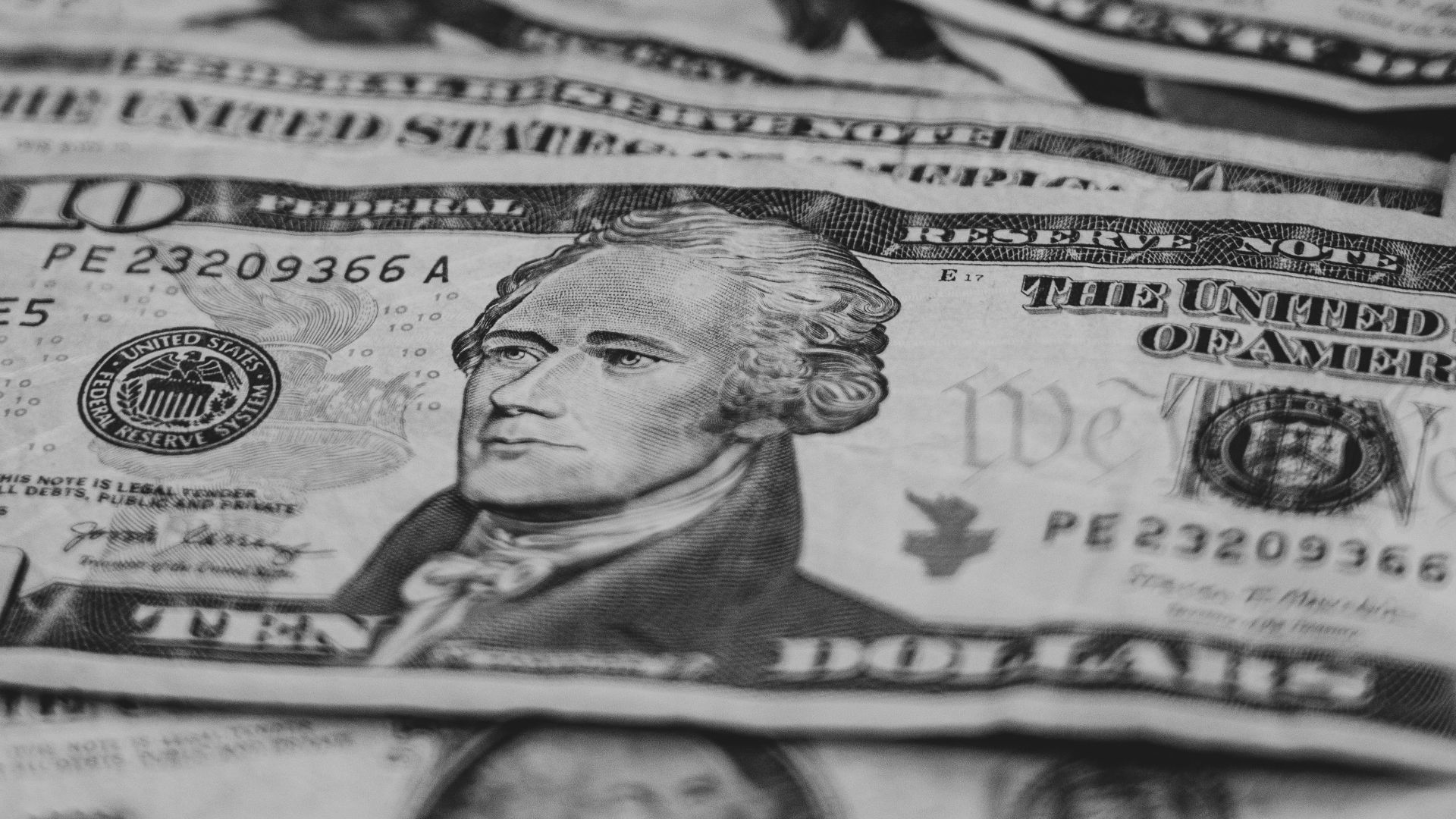 a pile of money sitting on top of a table