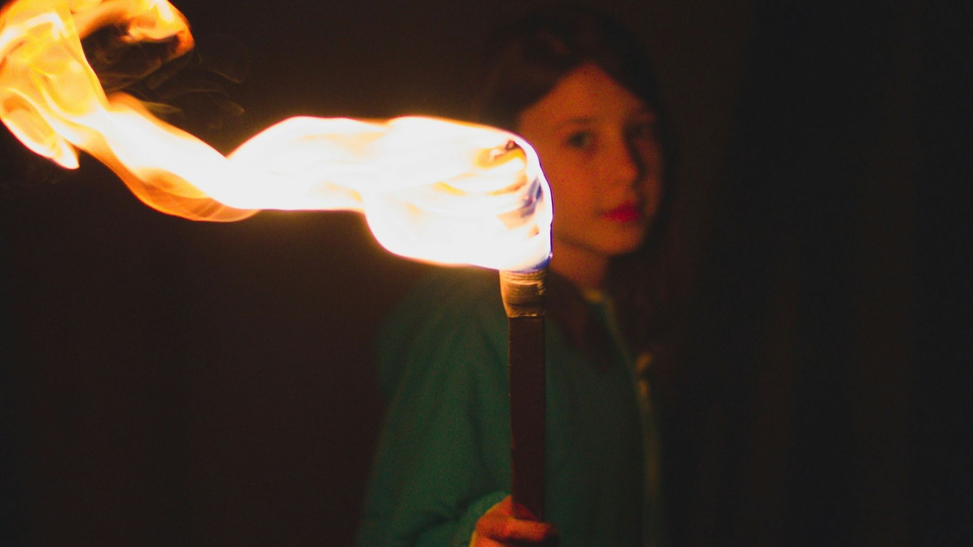 person holding torch during night time