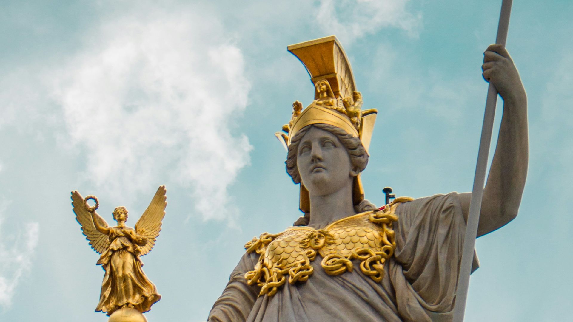 a statue of a lady justice holding a sword