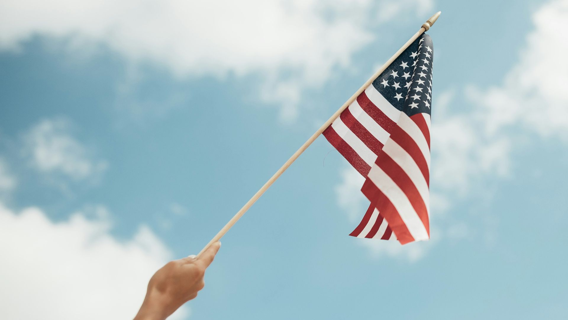 person holding U.S.A. flag