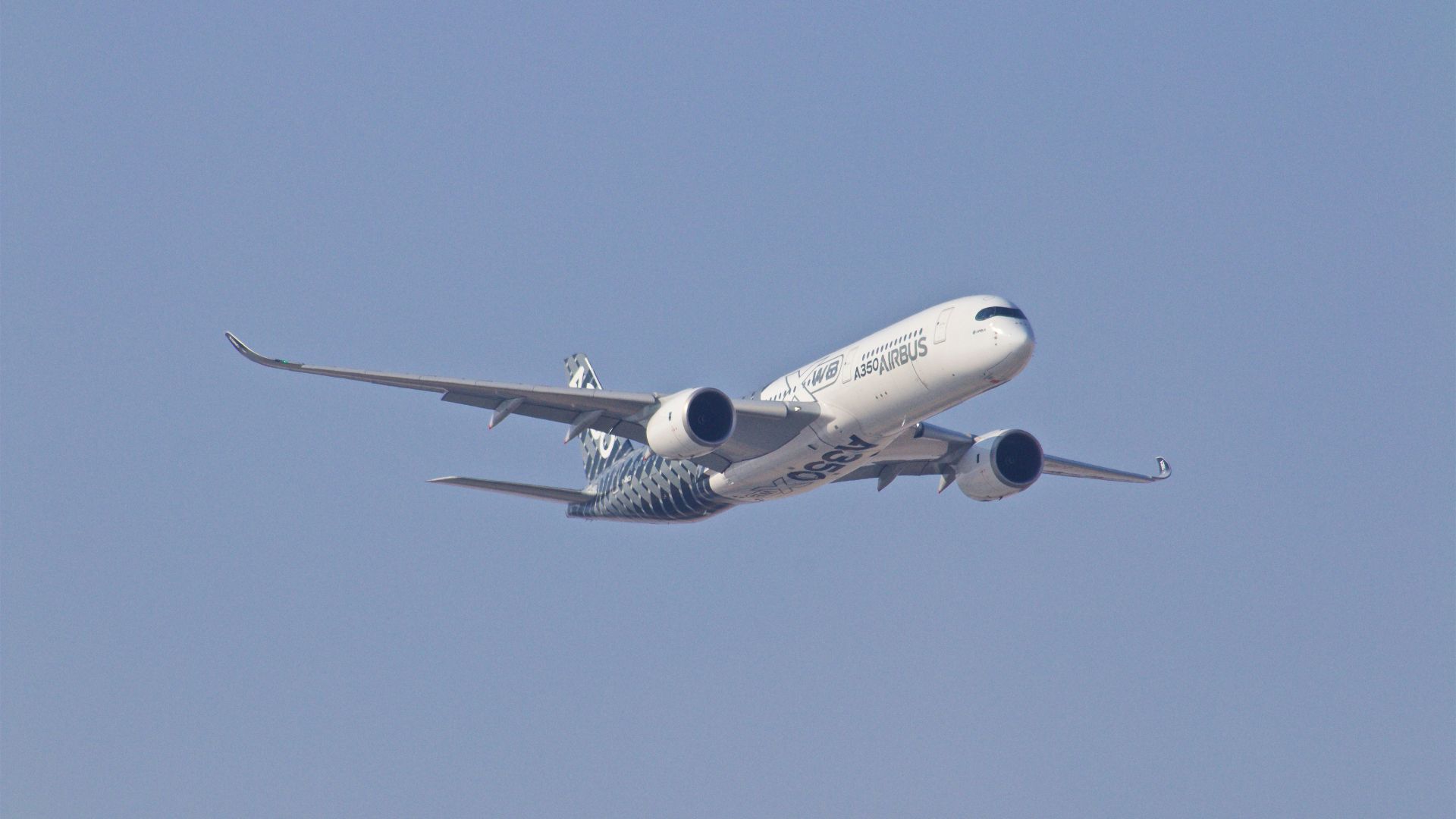 white airplane taking off during daytime