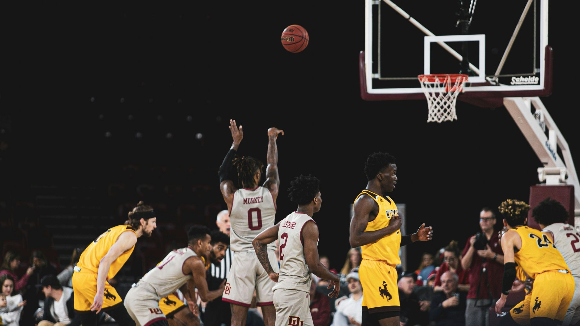 man shooting the ball on the free throw line