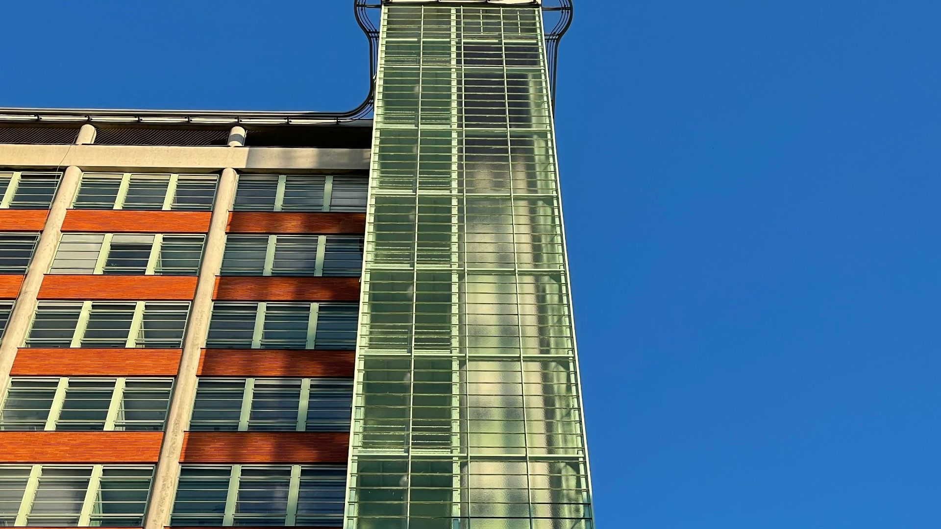a tall building with a glass front