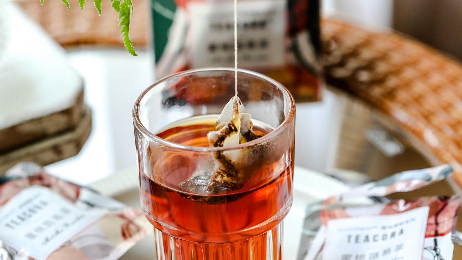 clear drinking glass with brown liquid