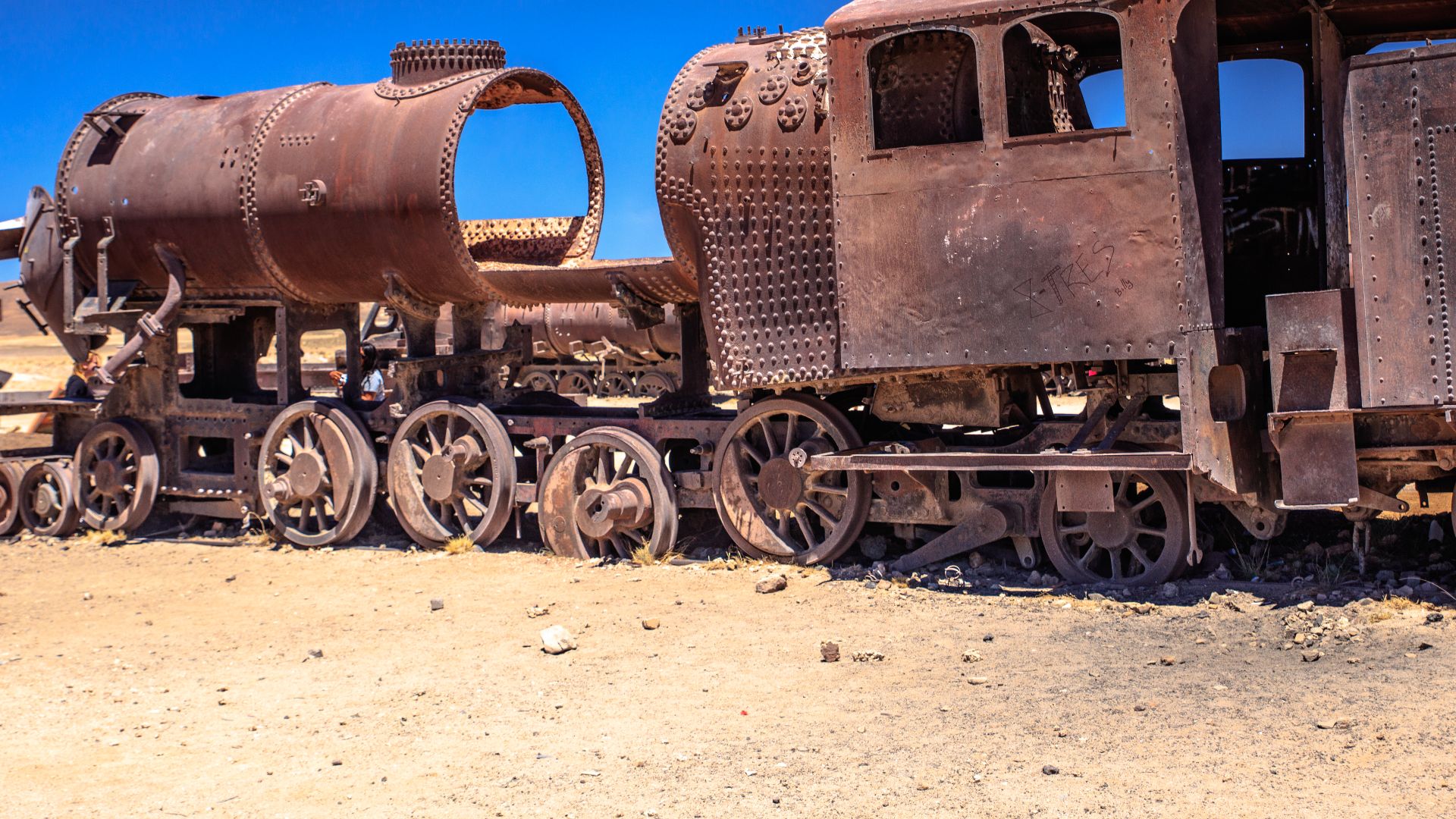File:Uyuni Train Cemetary - for over 100 years these relics have rusted away in the unrelenting Salar winds - victims of changing mining practices and the loss of a Pacific Port to Chile in the War of the (24543144890).jpg