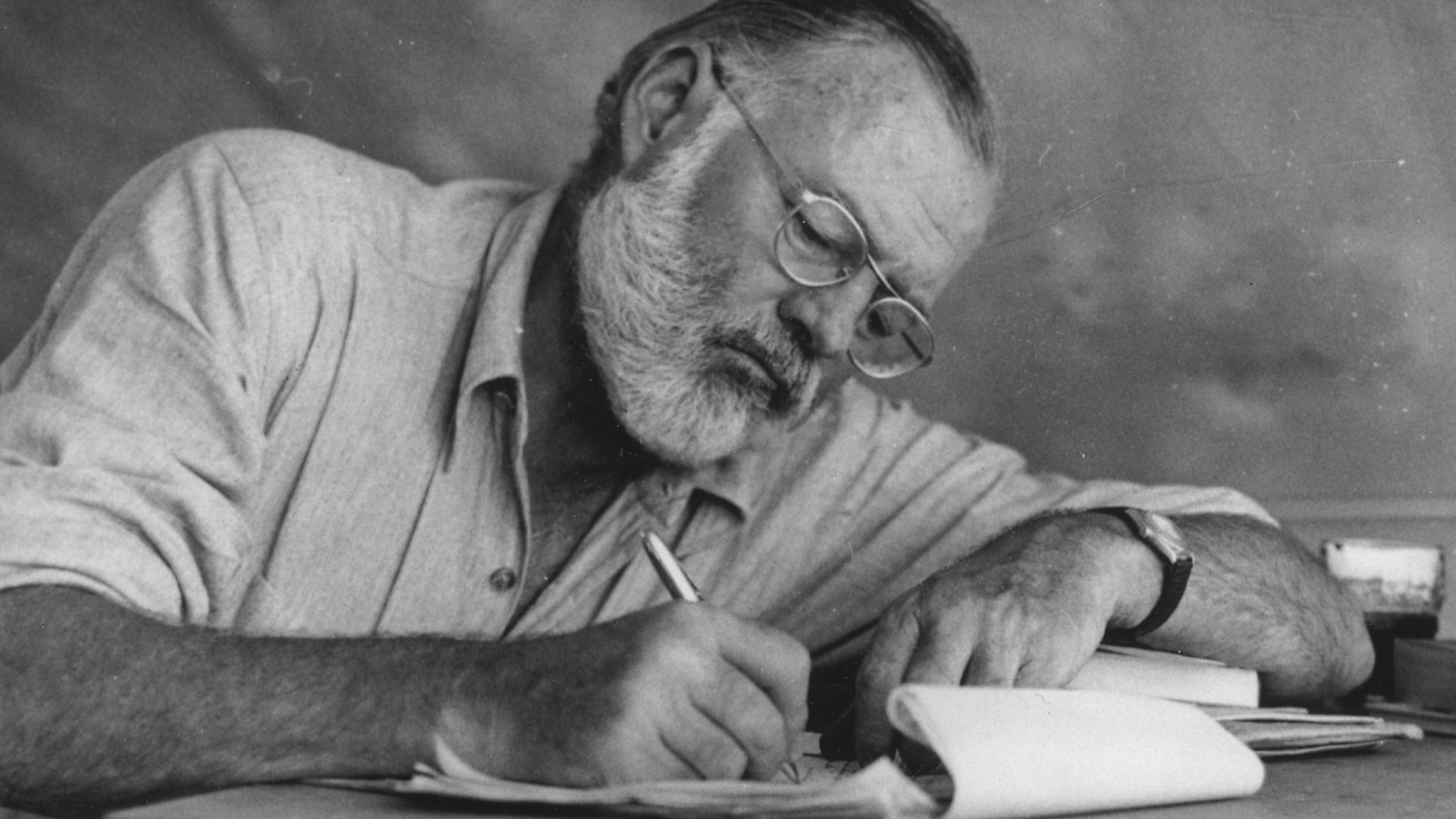File:Ernest Hemingway Writing at Campsite in Kenya - NARA - 192655.jpg