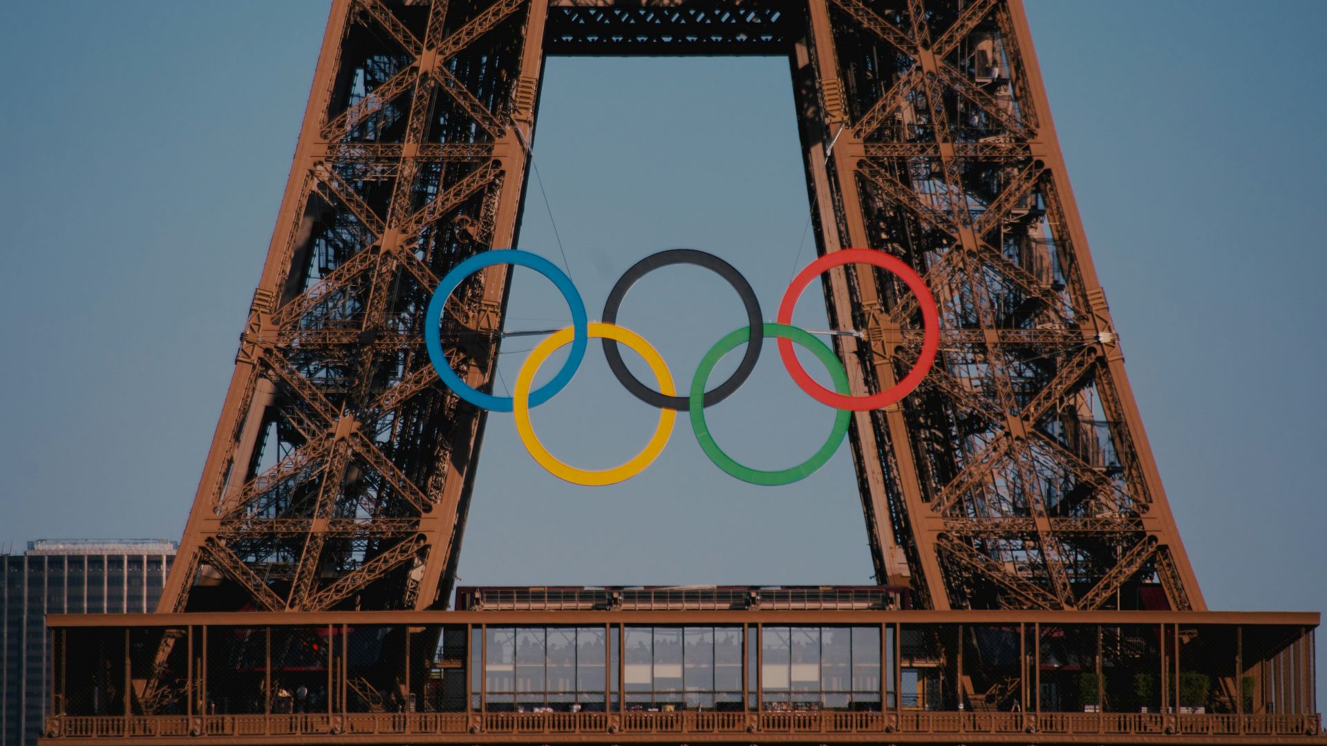 The eiffel tower with the olympic rings in front of it