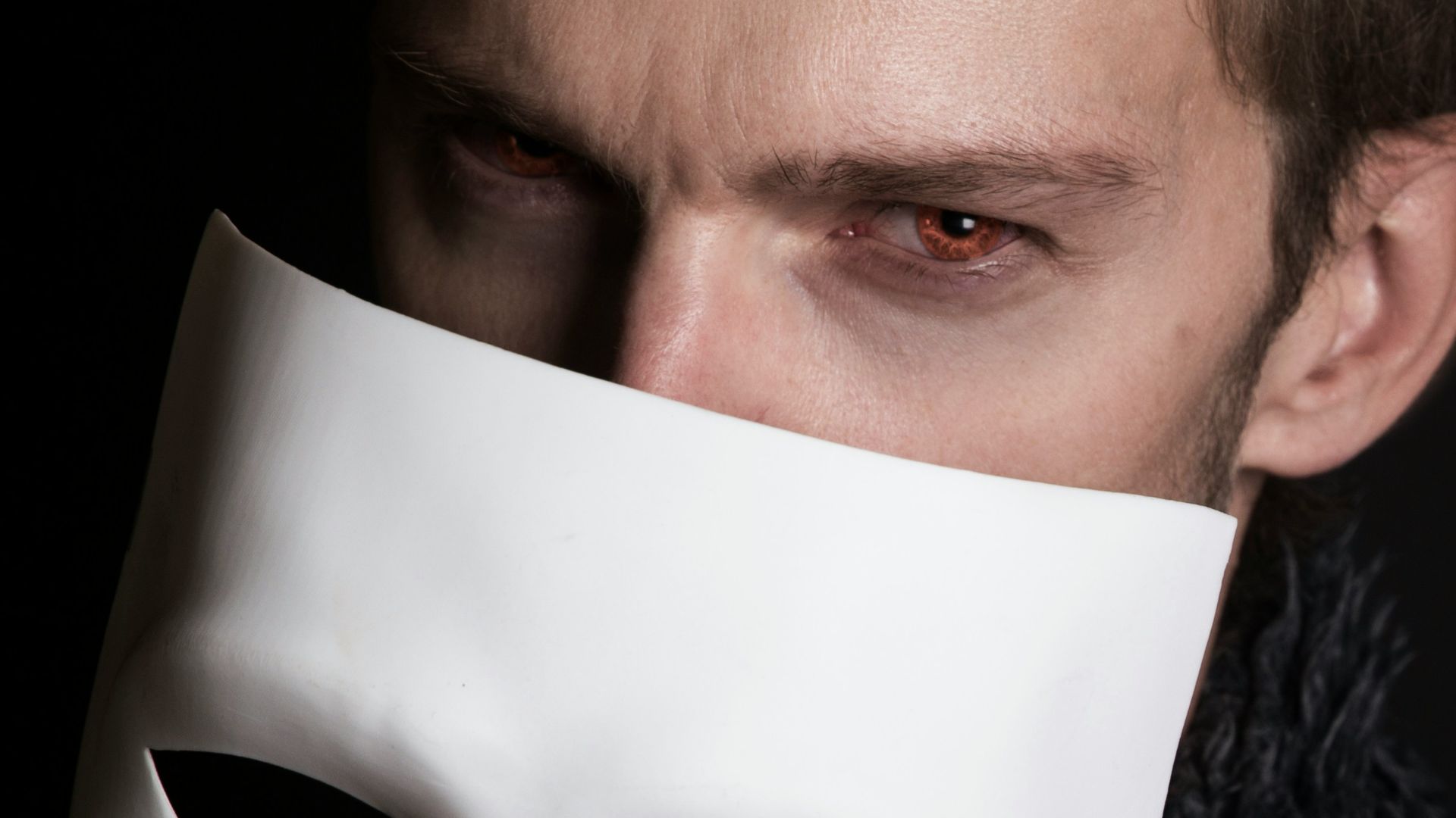 man with white face mask